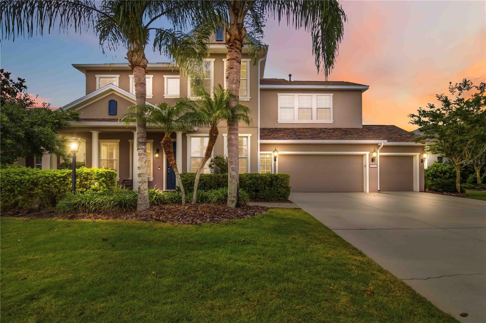 From the moment you pass through the gates and pull into the driveway, this four-bedroom, three-and-a-half-bath lakefront pool home makes a statement. With beautiful curb appeal, a wide sidewalk approach, and a three-car garage, the arrival sets the tone for what’s inside.

Step through the front door and you’re welcomed by a thoughtfully designed layout. A private office sits to the right—perfect for working from home—while a formal dining room or additional living space anchors the left. Tile floors carry you through the main living areas, leading you past a butler’s pantry and spacious walk-in pantry and into the heart of the home.

The open-concept kitchen features café appliances, a wine fridge, ample storage, and seamless sightlines to both the family room and casual dining area—ideal for everyday living and entertaining alike. Surround sound, ceiling fans, and abundant natural light enhance the space, while French doors invite you outside to the backyard oasis.

Out back, enjoy a wide lake view from your covered patio, complete with a gas grill hookup. The heated saltwater pool offers a sun shelf and spa, all enclosed with brand-new screens—creating a private retreat designed for year-round enjoyment with a brand new pool heater and pool pump that has a 3 year warranty!  Spa has a self dedicated heater for dual temperature optimization.

Upstairs, brand-new flooring and fresh paint continue throughout. A spacious bonus room provides flexible living space for a media room, playroom, or home gym. The primary suite located upstairs is a true retreat, featuring a soaker tub, glass-enclosed shower, and generous layout. Two additional bedrooms are positioned on one side of the floor plan, while a separate nanny, au pair, or in-law suite—with its own ensuite bath—sits privately on the other. And interior laundry room adds everyday convenience.  A fifth bedroom is located downstairs, which is currently being used as an office.

Additional highlights include a brand-new shingle roof, tankless water heater, hurricane shutters, exterior paint warranty, and new finishes throughout the entire home.

Located in a highly desirable gated Lakewood Ranch community, residents enjoy a centralized park with splash pad, playground, dog park, sports field, pavilion, walking paths, and sidewalks—plus proximity to top-rated schools and everything Lakewood Ranch provides

This is lakefront living, thoughtfully designed and move-in ready.
