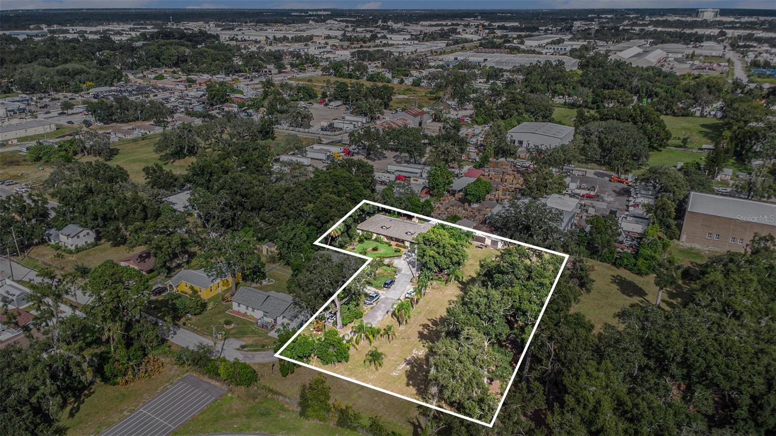 Rare opportunity to acquire 2.23 acres in a rapidly growing area of Tampa. Located at 5105 N 45th Street, this RS-50 zoned property offers exceptional redevelopment and investment potential while generating immediate utility from the existing improvements.

The property currently features a spacious 3,492-square-foot main residence built in 2005, offering 3 bedrooms and 2.5 bathrooms, as well as a separate 352-square-foot guest house built in 2007 with 2 bedrooms and 1 bathroom. Whether utilized as a primary residence, rental income opportunity, or interim holding asset, the existing structures provide flexibility while planning future development.

With over two acres of land in a desirable Tampa location, this property presents a unique opportunity for builders, developers, investors, or end users seeking to capitalize on the area's continued growth. The RS-50 zoning and substantial land area create potential for subdivision, redevelopment, or other residential development opportunities, subject to county approvals and due diligence.

Conveniently located near major roadways, employment centers, shopping, dining, and downtown Tampa, opportunities of this size and scale are becoming increasingly scarce. Explore the possibilities and unlock the full potential of this exceptional development site.

Buyer to verify all zoning, land use, development potential, and subdivision possibilities with Hillsborough County.