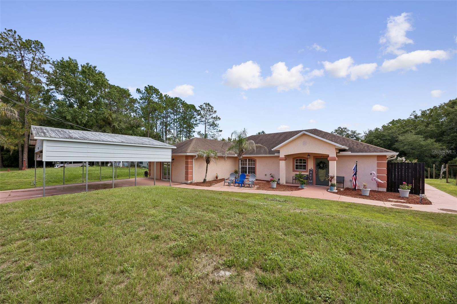 Waterfront Pool Home with Direct Access to the St. Johns River -Dive into the Florida waterfront lifestyle you've always dreamed of! This handicap-accessible concrete block home offers 2,400 square feet of comfortable living space on a beautiful canal with direct access to the St. Johns River, Crescent Lake, Dunns Creek, and beyond. Featuring 3 BR and 2.5 BA, this high-and-dry residence welcomes you with a spacious great room, soaring vaulted ceilings, & a cozy wood-burning fireplace. The oversized kitchen is designed for both everyday living & entertaining, offering LG appliances, a breakfast bar, country sink, pantry, abundant cabinetry, & generous counter space. The primary suite provides a peaceful retreat with a large walk-in closet & an accessible en-suite bath featuring dual vanities & a walk-in shower. 2 additional bedrooms share a full bath, providing plenty of room for family & guests. Step outside & enjoy your private pool, four-car carport, and storage shed/workshop. Come see it now!!