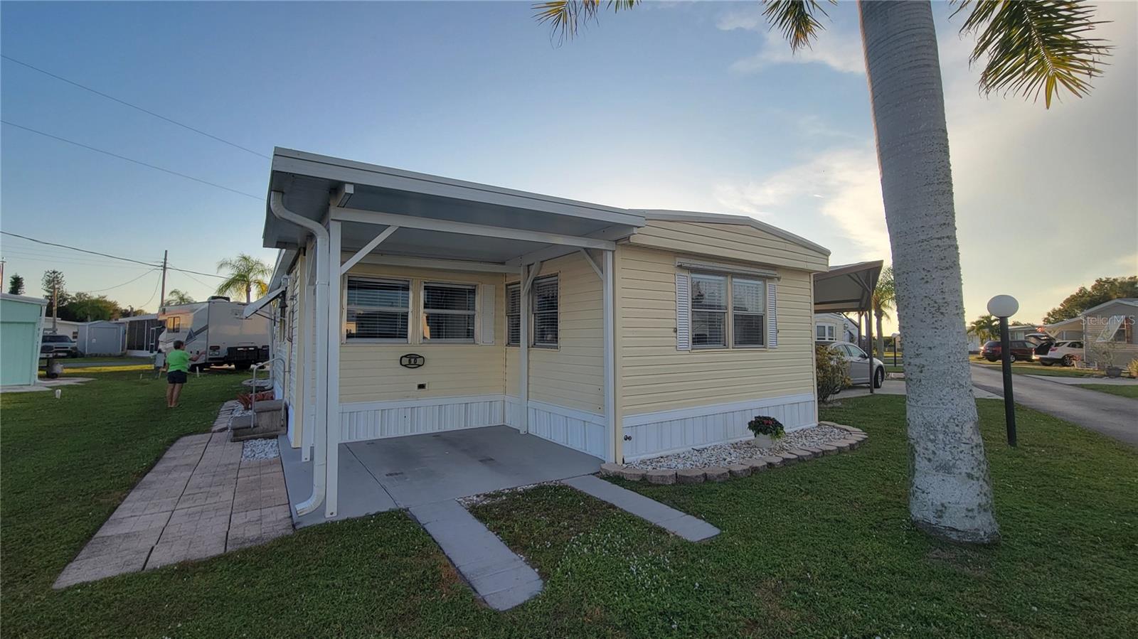 AMAZING OPPORTUNITY!  RECENTLY REDUCED HOA FEE! Only $210/mo.    ***The seller is offering a new 2025 48 Volt golf cart with and acceptable offer!!***   Discover the perfect blend of comfort, convenience, and community in this charming 55+ mobile home neighborhood! Nestled in the heart of Punta Gorda's Shell Creek area, Lazy Lagoon offers a relaxed, low-maintenance lifestyle surrounded by friendly neighbors and beautiful grounds.

This inviting get away features 1 large bedroom and 1full bathroom, with a bright, open floor plan designed for easy living. The spacious kitchen includes a dining area open to the living area. The family room is ideal for morning coffee or evening relaxation.  THE HOME COMES   COMPLETELY FURNISHED! There is a parking pad area to park your NEW golf cart when you're not visiting new friends. 

The community itself boasts a clubhouse, social activities, and wonderful neighbors making it easy to stay active and connected.

Conveniently located near shopping, dining, medical facilities, Punta Gorda's airport, and I75, this is the ideal place to enjoy your next chapter in comfort and style.

Don’t miss your chance to experience the best of 55+ living—schedule your private tour today!
