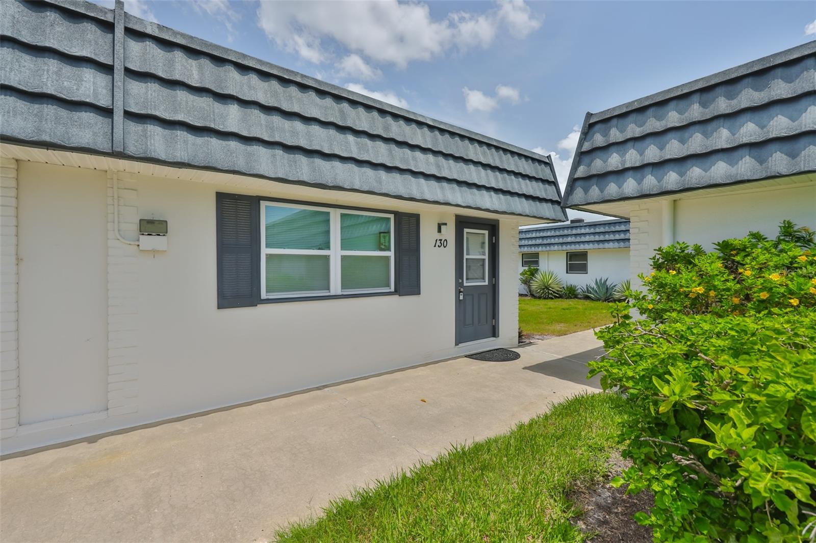 Beautiful 1BR/1.5BA Condo in 55+ Gated Resort Community. Welcome to easy living in this bright and beautiful condo located in the highly desirable Sun City Center. This charming unit has been renovated with brand new windows, stylish new flooring, and an enclosed back lanai perfect for relaxing year-round. Brand new electrical panel. The spacious layout features an open living and dining area, a generous primary suite with private full bath, and a convenient half bath for guests. Everything is designed with comfort and function in mind. Enjoy a maintenance-free lifestyle - the HOA covers most exterior maintenance, water, sewer, landscaping, and access to incredible community amenities. Residents have full use of resort-style pools, fitness centers, clubhouses, golf, pickleball, tennis, and endless clubs and social events. Tucked in a quiet, well-maintained neighborhood, this condo offers the perfect balance of privacy and connection in one of Florida's best retirement communities.