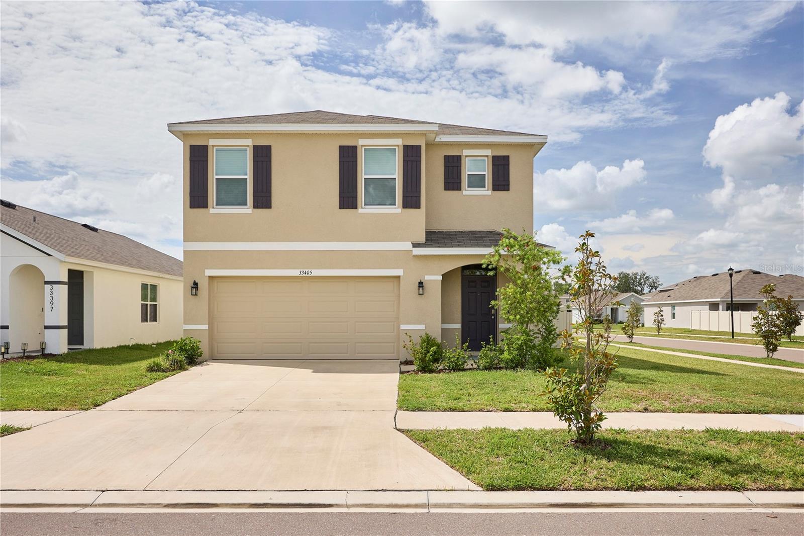 Welcome to this stunning 5-bedroom, 3-bathroom home offering modern style, spacious living, and exceptional convenience. Built in 2024 and maintained in mint condition, this move-in ready residence sits on a desirable corner lot with a fully vinyl-fenced backyard, providing both privacy and plenty of outdoor space to enjoy. Step inside to discover a bright and open floor plan designed for today's lifestyle, featuring generous living areas, a beautifully appointed kitchen, and spacious bedrooms that provide comfort for family and guests alike. The home's thoughtful layout offers flexibility for entertaining, working from home, or multi-generational living. The 2-car garage provides ample storage and convenience, while the newer construction means peace of mind with modern systems and finishes throughout. Ideally located in the highly sought-after Wesley Chapel area, you'll enjoy easy access to premier shopping, dining, entertainment, and major highways, making commuting a breeze while keeping everything you need just minutes away. Why wait to build when you can own this like-new home today? Schedule your private showing TODAY! This exceptional Wesley Chapel home combines modern living, location, and value—don't miss your opportunity to make it yours!