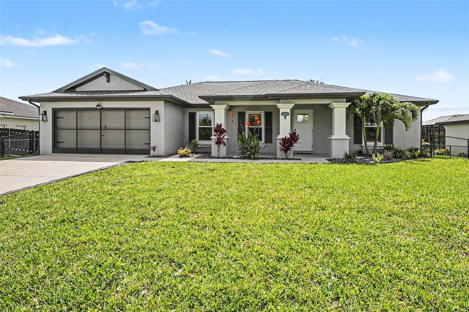 Welcome to one of Northwest Cape Coral’s most centrally located and conveniently positioned homes—where comfort, community, and peace of mind come together for the ideal start. Situated near the Pine Island corridor, this spacious property offers quick access to shopping, dining, parks, and everyday conveniences while also being assigned to some of the area’s most coveted public schools, including Mariner and Oasis. This friendly neighborhood is known for its true sense of community, where neighbors know each other and pride of ownership is evident throughout. Best of all, this home is connected to city water and sewer with ALL ASSESSMENTS PAID, and NO FLOOD INSURANCE is required here—an incredible advantage for both lifestyle and affordability. Meticulously maintained and thoughtfully updated, the home is loaded with NEWER MAJOR SYSTEMS and IMPROVEMENTS, offering buyers confidence and a stress-free purchase experience. Highlights include a new HEATED SALTWATER POOL with new paver deck and pool cage, IMPACT-RESISTANT WINDOWS and SLIDERS, newer HVAC system, newer roof, irrigation system, fence, water heater, and kitchen appliance package. Additional recent interior updates include a stylishly remodeled primary bath complete with a newly added private access door to the pool area, along with fresh interior paint. Exterior improvements include newer paint and a screened garage enclosure for added versatility and comfort. Inside, soaring high ceilings and abundant natural light create an open, airy atmosphere that immediately feels welcoming. NO CARPET throughout most of the home makes it an ideal option for pet owners and those seeking easy maintenance and modern living. Designed with both functionality and privacy in mind, the split floor plan creates separation among household members while maintaining excellent flow for entertaining and everyday living. A versatile den with French doors offers the perfect flex space for a home office, media room, or guest retreat. What's so unique about the floor plan is the flow around the den, which offers direct access to the Jack-and-Jill bath that also connects the guest bedrooms. Whether relaxing poolside, enjoying the welcoming neighborhood atmosphere, or taking advantage of the unbeatable location, this home offers a blend of convenience and the affordability advantage thanks to new systems, no flood insurance, and no assessments!
