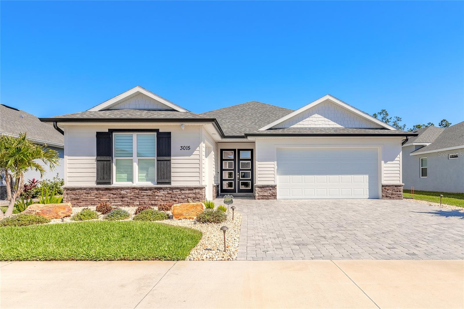 Welcome to this 2022 Johnson Built 3 bedroom, 2 bath 1985 Square foot home located in Venetian Bay. The home is on a large lake with a spectacular view of water, tree line, and nature at its finest. For convenience there is a full 2 car garage and an additional separate toy garage for golf cart, motorcycles, kayaks, extra refrigerator, or just some additional storage. The home was built for easy maintenance. The landscaping features aluminum edging surrounding the entire home with weed blocker and river rock stone. Newly repainted exterior in March 2025 with Sherwin Williams Aura for durability, protection, and easy clean up. A oversized paver driveway  is both functional and aesthetic pleasing.Inside the home is upgraded large porcelain wood plank tile throughout, white soft close cabinets and draws in kitchen, both bathrooms, and laundry room. Cambria upgraded quartz countertops on all cabinetry.There is double crown molding in main living area, single crown in all bedrooms, bathrooms, and laundry room.All closets have no wire shelving and were upgraded at construction with custom built ins for added storage and a luxury look.Kitchen appliances are all upgraded including a slide in 60/40 split oven for the times you need 2 ovens. There is a large covered paver screened patio with electronic hurricane shutters, tongue and groove wood ceiling, 2 exterior ceiling fans,  wired for tv, and additional connected area that is a large screened lanai. The covered lanai also has rough plumbing with hot and cold water and drain for future summer kitchen. All garages feature high end epoxy garage floors, ceiling fans, pre wired for tv in both garages, and side mounted upgraded garage door openers. The 2 car garage has 2 pre-wired electric car charges and has a whole house culligan water system. A 400 amp service powers the home, AC unit features an air scrubber and UV light for clean air. There are 2 sun tunnels for added natural light in kitchen and laundry room, windows are decorated with white wood valances, automated black out roll down shades, and all pavers were sealed.This is without a doubt a truly move in ready home that will be easy to maintain the way it was designed and built, there is nothing to do but move in. No pictures were ever hung on walls, its ready to make it yours. All information is intended to be accurate however not guaranteed.