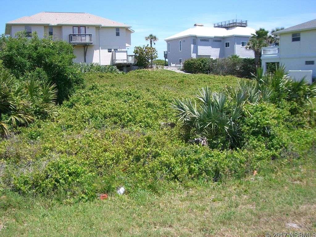 This beautiful ocean front lot is perfect for a family beach home, steps away from the beach with privately deeded access. It is conveniently located in south New Smyrna Beach within a mile of the famous Flagler Ave.; Cleared: Partial ;Water: Holding Tank