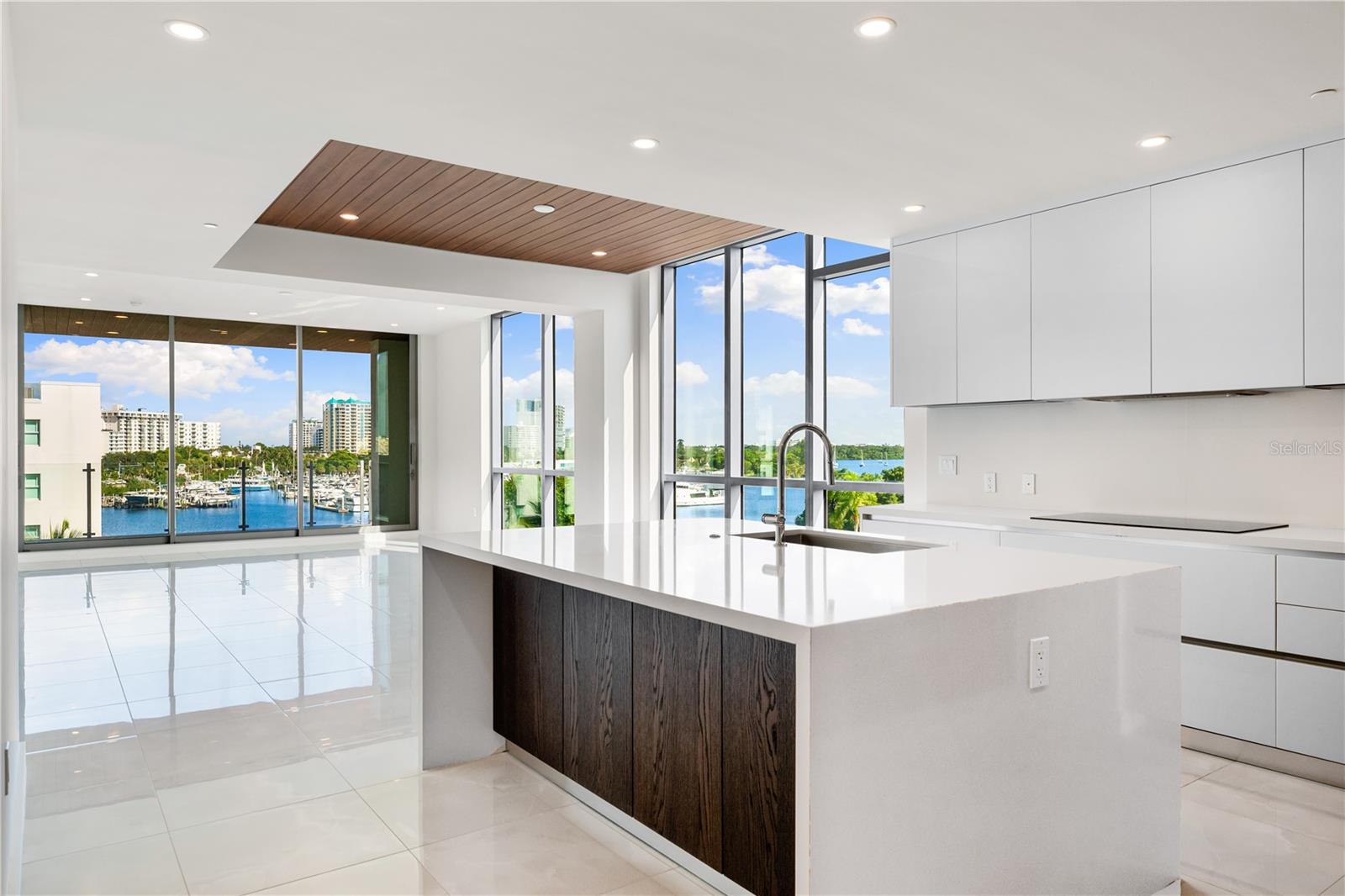 New construction. No wait. No stress. Unit 403 at The Evolution is a completed 3-bedroom, 3-bath luxury residence designed by award-winning architect Mark Sultana of DSDG. Inside, you’ll find 2,050 square feet of elegant interior living and over 300 square feet of outdoor space across three private balconies, ready for move-in today. Ten-foot ceilings, imported European cabinetry, polished porcelain tile, and top-tier Sub-Zero and Wolf appliances create a timeless, functional space that’s both beautiful and easy to maintain. The primary suite opens to a shared balcony for peaceful mornings or sunset gatherings, and your private deeded 2-car garage offers extra convenience. This boutique community of just 20 residences includes a rooftop lounge with a sunset spa and fireplace, a resort-style pool with private cabanas, a fitness studio, a European sauna, an outdoor kitchen, and full-time concierge service. Located on Golden Gate Point, you’re minutes from Sarasota’s top restaurants, the arts, and stunning Gulf beaches. Let’s schedule your private tour and show you what move-in-ready luxury really feels like.