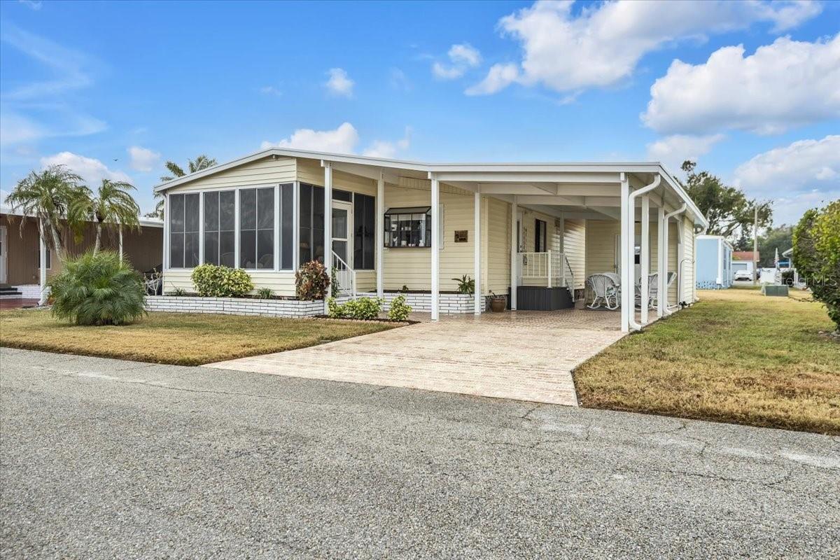 Welcome to Palm Lake Estates – a highly desirable 55+ community in the heart of Bradenton! This beautifully land owned updated and move-in ready 2-bedroom, 1.5-bath home is being sold fully furnished and features abundant storage, ceiling fans throughout, and an oversized primary suite with a private en-suite half bath. No lot rent! Enjoy affordable Florida living with a low $275/month maintenance fee that includes cable, internet, water, sewer, trash, community pool access, and on-site management. Recent upgrades include a new roof, new carport, new vapor barrier and new heat pump for added peace of mind. Palm Lake Estates offers an active lifestyle with planned activities, social events, and a welcoming neighborhood atmosphere. Ideally located near shopping, dining, medical facilities, airports, this home is perfect for full-time residents or seasonal living. Affordable, updated, and ready for you — schedule your private showing today!