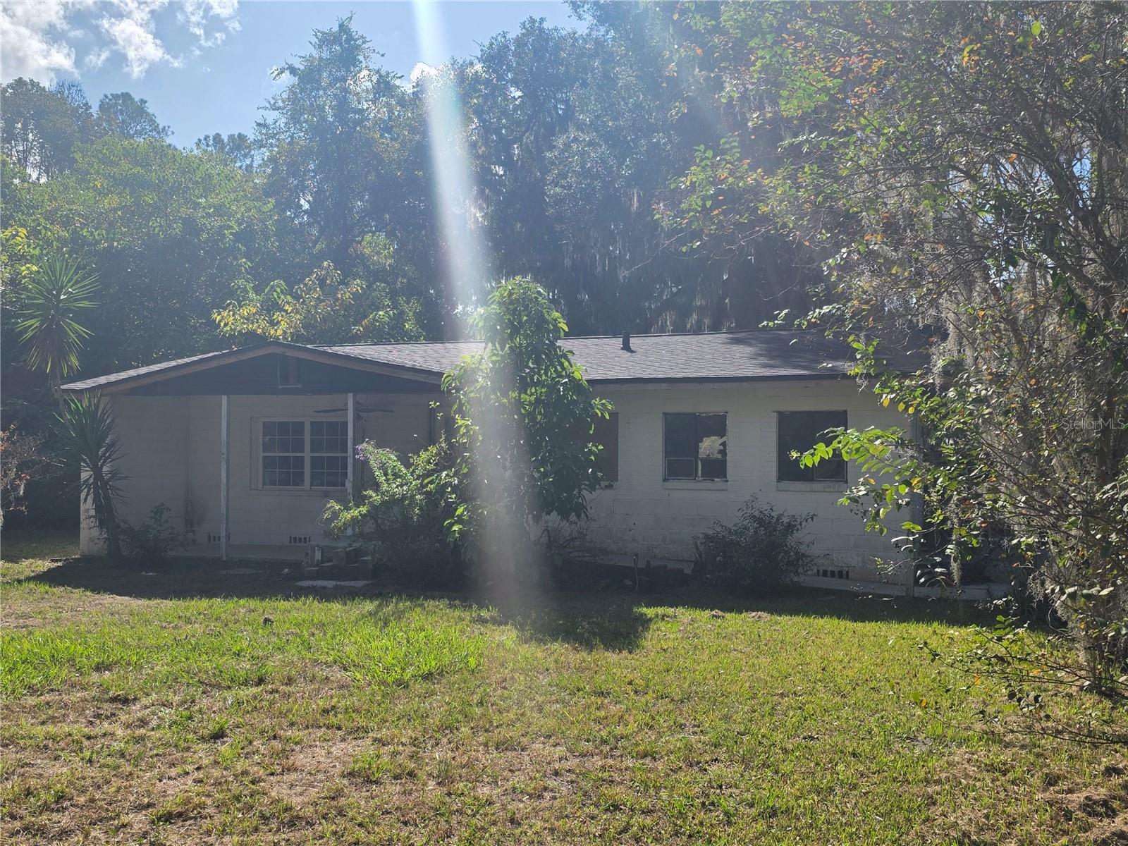 Let your imagination run wild and make this charming home your own. This property features a new roof and truss system (2024), along with new interior and exterior doors and windows, which are currently in storage. Additionally, new vinyl flooring is also in storage. The plumbing and electrical systems have been upgraded, and new subfloors have been installed. Property taxes are current. The home is situated on approximately half an acre.