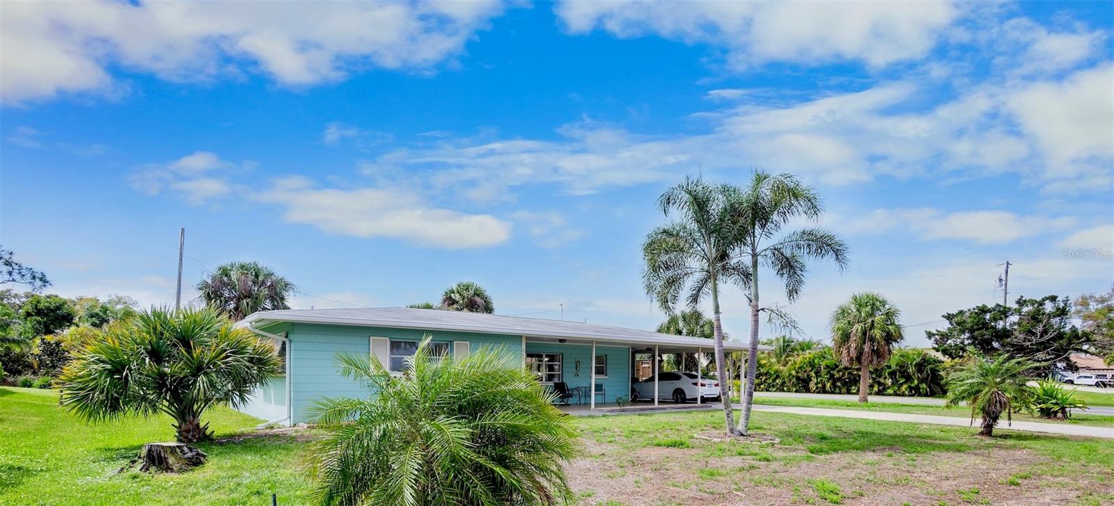 Mid-Century home located West of the Trail, just minutes from Nokomis Beach. This lovingly maintained property perfectly captures the coastal lifestyle, situated in a vibrant neighborhood where residents frequently walk, bike, or take golf carts to enjoy the beach and local sunsets.
The interior features gleaming terrazzo floors throughout, an open kitchen equipped with quartz countertops and a large island, and an expansive owner's suite with an ensuite bath. Additionally, the home includes a large guest bedroom and a versatile, air-conditioned Florida room that can serve as an office or additional guest space. Outside, the extra-large lot offers significant room for a pool or further expansion, complemented by an extensive front porch and a screened back lanai. Offered Turn Key Furnished.