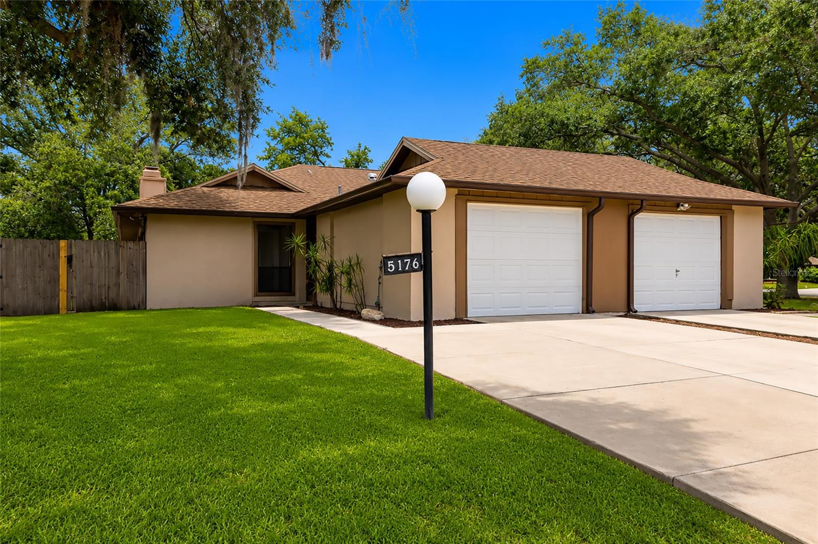 Virtually Staged. Welcome to this beautifully updated 2-bedroom, 2-bathroom home in the highly desirable Cedar Hammock community - offering exceptional value and move-in ready comfort.  Step inside to an open, light-filled layout featuring newer luxury vinyl plank flooring, updated ceilings, recently painted inside and out, creating a clean, modern feel throughout. The kitchen has been tastefully upgraded with white shaker-style cabinetry, and stainless-steel appliances, making it both stylish and functional for everyday living.  The lanai has been converted to a bonus room providing additional living space for your enjoyment. You will be able to enjoy the cool Florida winter evenings in front of your stone-faced wood burning fireplace in the great room.  The bathrooms have been tastefully updated providing a clean and modern feeling.  The Home provides flexible living space perfect for relaxing or entertaining.  A one-car garage and inviting outdoor space with a fenced yard adds to the home’s overall appeal.  Major systems are in solid condition, including a newer roof and HVAC system, providing added peace of mind.  Located in a quiet neighborhood with ultra-low HOA fees, this home is just minutes from shopping, dining, downtown Sarasota, and world-famous Gulf beaches.  Don’t miss this opportunity. Homes in Cedar Hammock rarely come available in this condition and price range. Schedule your showing today.