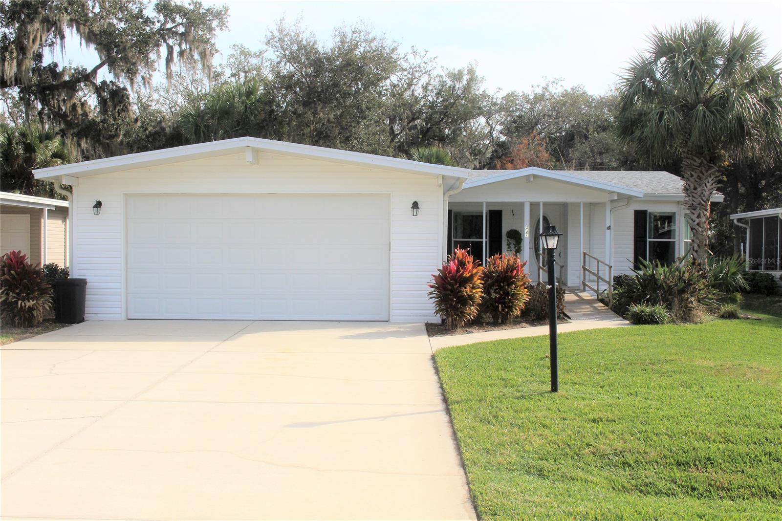 Charming two-bedroom, two bath home is located a short distance from the fishing pier and boat launch. This open concept home features tile flooring throughout, a custom designed kitchen with plenty of cabinets, Silestone countertops, breakfast bar, den, two car garage and a utility/workshop. Relax and enjoy afternoon breezes on your screened patio while watching the birds and squirrels. New roof 2021, HVAC condenser replaced in 2022, newer appliances including washer and dryer and a termite bond. If desired, one side of the home can be used as separate guest quarters. Watch the rocket launches from your own backyard. (Chandelier over the dining table does not convey).  All information deemed accurate but not guaranteed. All measurements approximate. Not a rental community, own your own land. Lighthouse Cove is a beautiful riverside community with a large, heated swimming pool, clubhouse, tennis and pickle ball courts, shuffleboard courts, boat launch for shallow water boats, recreational picnic area on the river and a fishing pier. Lighthouse Cove has weekly events at the clubhouse. Golf carts are a second means of transportation.  Don't miss out. A great opportunity to live in paradise!!! This home will not last long. ;Water: City