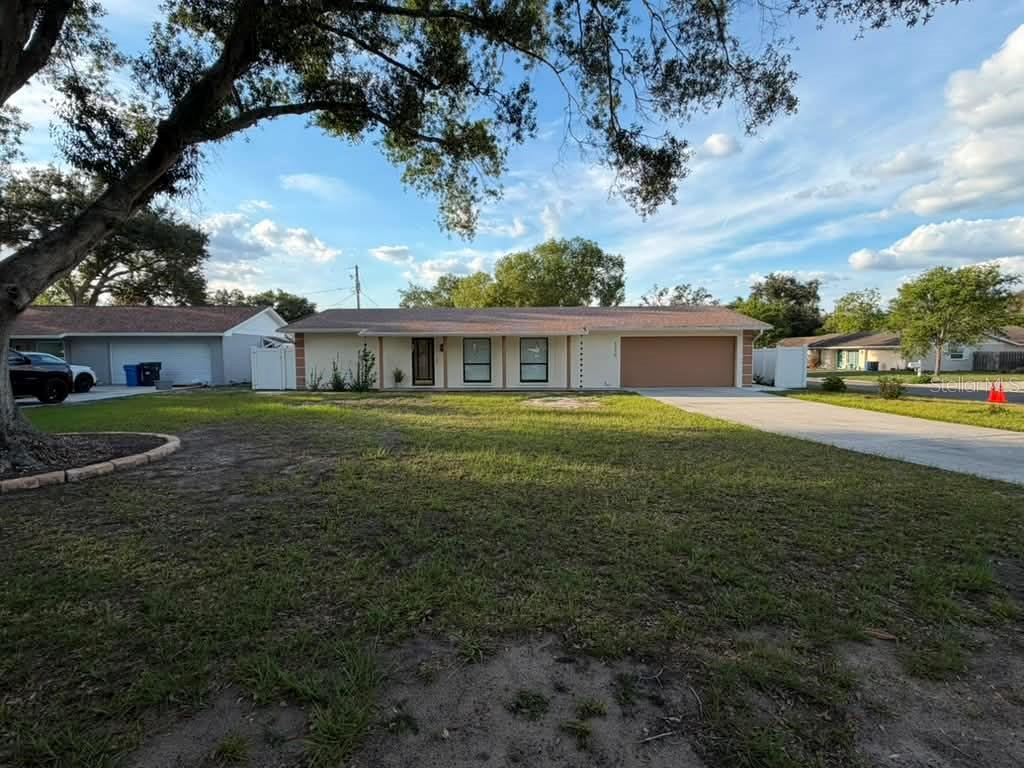 Welcome home! NO HOA!!! This beautifully updated 4-bedroom, 2-bathroom home sits on a desirable corner lot in a quiet cul-de-sac and offers comfort, functionality, and plenty of upgrades. Inside, you’ll find a spacious living and dining room combo filled with natural light, tile flooring throughout, updated LED lighting, and upgraded outlets and switches across the entire home. The galley-style kitchen features stainless steel appliances, corian countertops, and a cozy breakfast nook.The climate-controlled 2-car garage includes its own private entrance, making it ideal for a gym, office, workshop, or flex space. The home also features a tankless water heater, screened-in covered patio, and a spacious 14’x10’ backyard shed with concrete foundation for additional storage or workspace. Enjoy the fully fenced backyard with newly installed PVC fencing, gutters already installed, fresh interior and exterior paint, and a NEW ROOF (2021). The extended side concrete driveway and gated side entrance are perfect for RV, boat, or trailer parking. Conveniently located near shopping, dining, entertainment, and major highways. Move-in ready and packed with value — schedule your private showing today! The seller agrees to contribute $10,000 toward the buyer's closing costs in exchange for a full-price