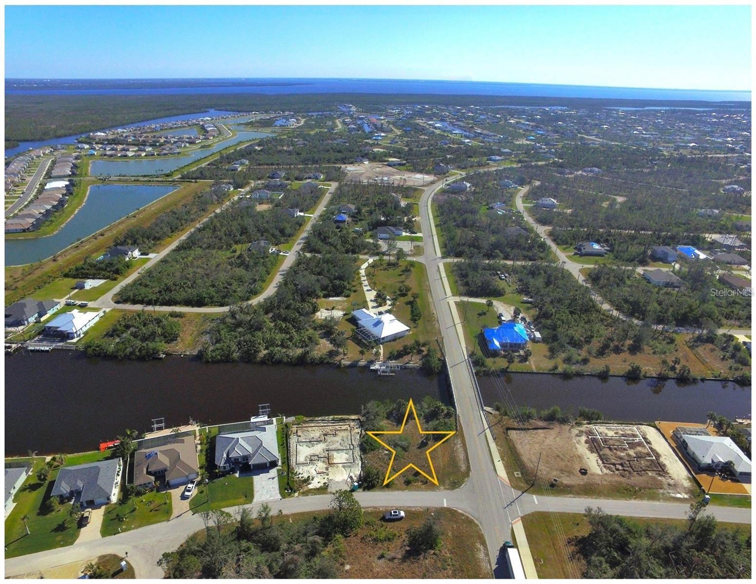 PERMIT ISSUED - Waterfront Lot with 115 feet of shoreline on this oversized lot giving you access to the Charlotte Harbor and then the Gulf of Mexico. All utilities are in place. The community offers over 50 miles of navigable waterways, multiple parks, a playground, sidewalks and a public boat ramp. The property is located roughly 20 minutes to the Beaches on Boca Grande Island, 15 minutes to major shopping / dining and 10 minutes from over six semi-private golf courses.