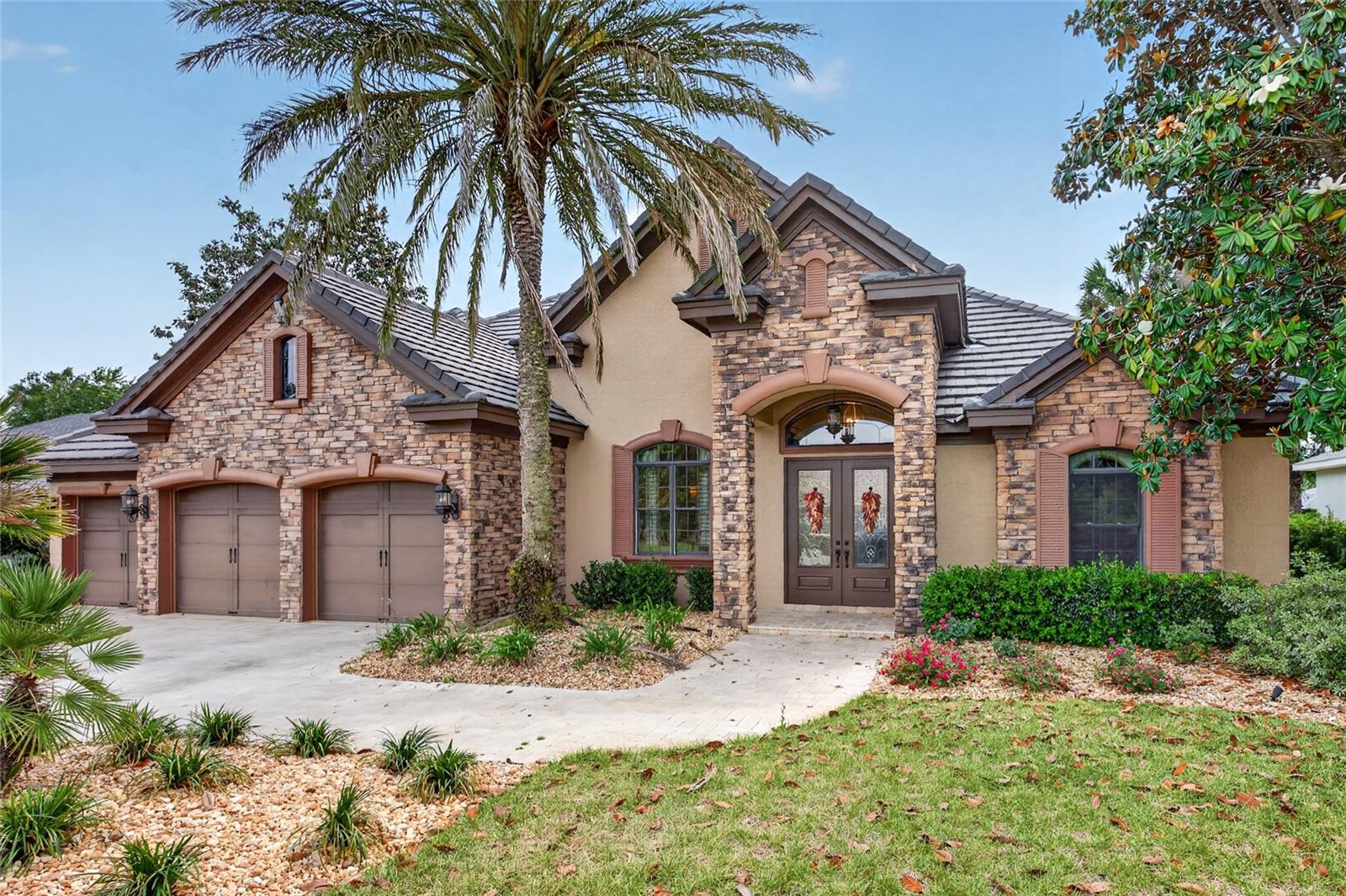 Welcome to this stunning Arthur Rutenberg model home located the prestigious Juliette Falls. This 3,250 square foot, 4 bedroom 3 bath home is filled with "wow" factor, and all FURNITURE IS INCLUDED! From the craftsmanship of the wood coffered ceilings in the Living Room to the drama of the chef's kitchen, each room is full of elegance. The dedicated OFFICE/READING ROOM is the perfect blend of old world beauty and the convenience of a large work space. The kitchen boasts large cabinets, Viking appliances, granite counters and Breakfast Nook. It also opens up to the oversized Family Room which is a perfect set up for entertaining. The Owner's Suite is bright and open yet so inviting. The large bath has a walk in shower and soaking tub. But the room that will be the most talked about is the perfectly appointed Gentleman's Game Room. With poker table, bar with a fridge and a sliding door that opens up to the lanai, this definitely feels like straight out of a country club. The outdoor area is nothing short of breathtaking! The very large lanai has a TV, Summer Kitchen, Travertine decking and opens up to the massive pool area complete with HOT TUB. The AC units have been overhauled and much of the duct work as well as insulation has been updated. There is also a brand new $7000 water filtration unit and a Generac whole house generator. Located on a premier lot with no rear neighbors and within walking distance to the club house, this is truly a one of a kind experience of a home!