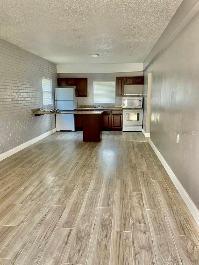BACK ON MARKET — NOW PRICED UNDER $300K! Seller offering a $5,000 buyer closing cost credit. Occupied Winter Haven duplex generating $2,550/month in gross rental income. Both units are 2 bed / 1 bath and feature stone countertops, laminate flooring, and separate living spaces. No carpet. No HOA. No current vacancy. This property offers immediate income from day one with a practical two-unit setup for long-term rental demand. Located in a quiet residential area less than 2 miles from public schools, near Winter Haven’s Chain of Lakes, Lake Shipp Park, public boat ramps, trails, shopping, dining, and approximately 20 minutes from LEGOLAND Florida. Investors looking for an income-producing asset under $300K should take a serious look. Schedule your showing today.