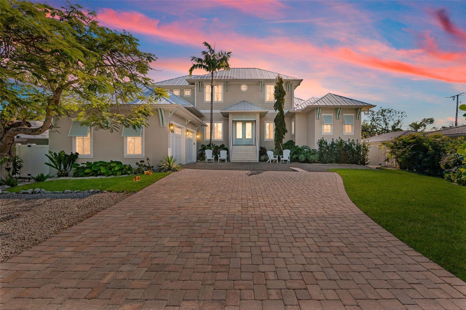Impressive coastal luxury home featuring exquisite finishes throughout and only a block from the beach in the famous Lido Key, Sarasota. Generously sized en-suite 5 bedrooms, and 5 ½ bathrooms, along with a 2-car garage, pool, spa, and slide that is certain to please either homeowner or investor looking to invest in an income-producing vacation rental. Turnkey furnished, this beautiful home is ready for a seamless transition. Located just steps away from St. Armands Circle, this home is in the heart of one of Florida’s most sought-after-destinations. Enjoy a perfect Florida morning or evening sipping coffee or cocktails on the rooftop, watching the sunrise or sunset, and ocean waves. The main level features 2 suites that offer Daiken minis for added comfort for those who enjoy undisturbed, optimal sleep in cooler temperatures, a living room, and an open kitchen with 2 built-in ovens, refrigerator, gas cooktop, leading into the dining room. Expansive high ceilings and vast window treatments create a bright & spacious atmosphere. The second level features 3 spacious suites, as well as a game room. This home pays attention to detail on finishes and is designed with Florida living in mind. This premier location places you at the center of Sarasota’s most vibrant coastal lifestyle. World-class dining, boutique shopping, cafés, galleries, and the white sand beach of Lido Key are just moments away from your door. Downtown Sarasota’s cultural attractions, year-round events, marina, and waterfront dining are a short drive over the Ringling Bridge. This beautiful estate offers a unique opportunity in a location defined by prestige, walkability, and timeless coastal charm.