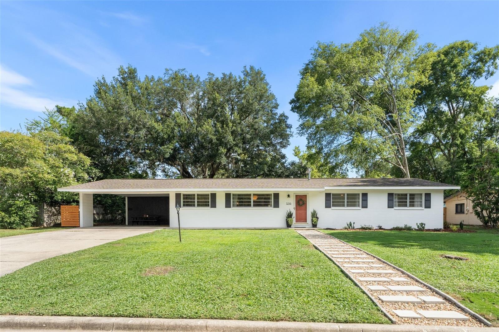 Welcome home to this beautifully updated property in the heart of Gainesville! Featuring a bright, open floor plan, this move-in-ready home has been thoughtfully renovated from top to bottom. The kitchen boasts quartz countertops, a large island perfect for gathering, a double oven, and plenty of space for cooking and entertaining. Throughout the home, you'll find refurbished terrazzo floors complemented by new baseboards, fresh interior paint, updated bathrooms, and stylish new light fixtures. Major system updates provide peace of mind, including a new roof and water heater (2022), HVAC system (2018), and a brand-new septic system and drainfield (2023). With all the big-ticket items already completed, all that's left to do is move in and start enjoying your new home. Outside, you'll appreciate the convenience of a two-car carport and a unique bonus: a chicken coop complete with nine laying hens, providing fresh eggs right in your own backyard!