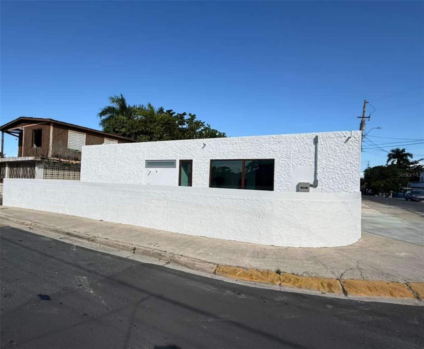 Fully remodeled turnkey residence with private pool located on a corner lot in Comunidad Mameyal, Dorado. Offered fully furnished and equipped, this modern concrete home features 4 bedrooms, 3 bathrooms, approximately 1,746 GLA sqft, and multiple indoor and outdoor entertainment spaces ideal for primary living, vacation use, or short-term rental operation.
The property includes new ceramic flooring, updated aluminum and glass windows, 7 split-unit air conditioners, covered metal terrace, outdoor kitchen, dedicated laundry/storage area, generator, cistern, gas tank, and expansive paved social areas surrounding the pool.
Completely renovated with no deferred maintenance and condition comparable to new construction. Move-in ready and ideal for Airbnb or turnkey investment use.