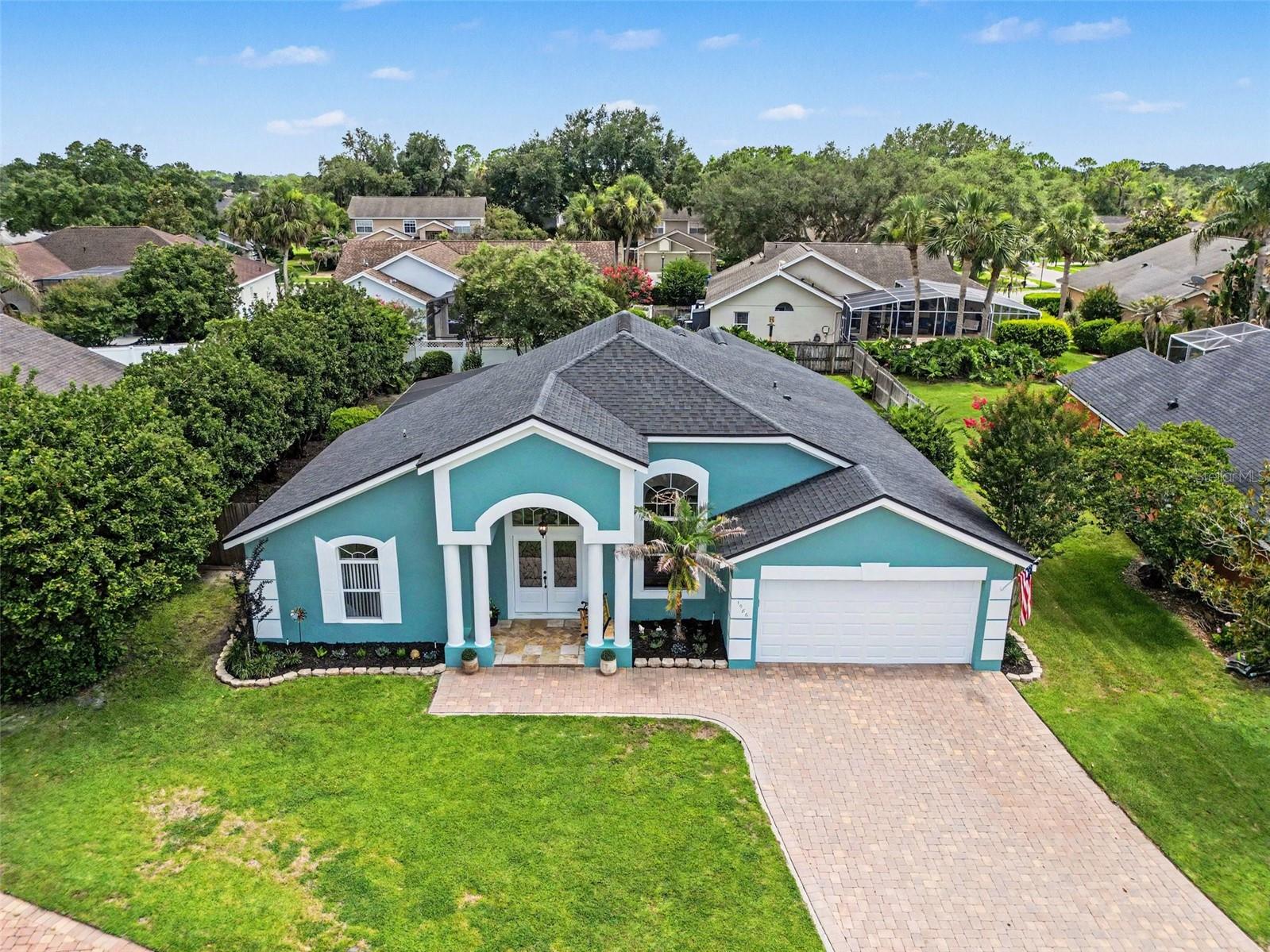 Welcome to this beautifully updated 4-bedroom, 2-bath home where comfort, style, and outdoor living come together seamlessly. Thoughtfully enhanced with luxury lighting fixtures throughout, the home offers a warm, inviting atmosphere and a modern touch in every room. With a split floor plan, eat-in kitchen, and large fenced yard, there is room for all family members to enjoy time together or retreat to their own space. ROOF 2017. AC 2017, Water Heater 2026

Once inside the grand entrance marked with double glass doors and high vaulted ceilings, you'll be struck by the abundance of natural light though oversized windows. Step to your left for the primary suite that spans from the front to the back of the house! You do not want to miss seeing the primary ensuite! You'll feel like you stepped into an elegant spa with crystal chandeliers over the designer vanities, floor to ceiling tile inset with mother-of-pearl design, large glass walk-in shower, and oversized soaker tub. Even the walk-in closet with custom built shelves and drawers is complete with it's own chandelier.

The gourmet kitchen is found centrally located in the heart of the home. With timeless granite counters and sleek appliances, you'll be ready to entertain gatherings large and small in this versatile eat-in kitchen complete with bar stools and breakfast nook. Equally convenient is the indoor laundry room just off the kitchen for easy access to modern living.

You're going to love relaxing in your new cozy family room designed with entertaining in mind. This open concept floor plan at the back of the home provides opportunity to enjoy watching your favorite channels on the oversized wall-mounted TV that conveys above the stunning electric fireplace with floor to ceiling stone. 

Step outside through the newly installed glass doors to your own private backyard retreat. The sparkling pool serves as centerpiece to your outdoor oasis, surrounded by mature, professionally maintained landscaping that provides both beauty and privacy. Watch the cardinals, herons, and hummingbirds gather as you sit on your pool deck with your morning coffee, recline in the pool for your personal happy hour, or relax around the wood burning fire pit past sunset. 

Inside and out, pride of ownership is evident in the home's carefully selected upgrades and meticulous maintenance. The attractive landscaping enhances curb appeal and creates a welcoming first impression from the moment you arrive.

Ideally located in the center of Oviedo, this home offers convenient access to top-rated schools including UCF and Seminole State, shopping, dining, parks, and major commuter routes. You're minutes from 20 miles of Cross Seminole Trail for bike riding and 44 mile Econlockhatchee River for kayaking. Enjoy the perfect balance of neighborhood charm and everyday convenience in one of Central Florida's most sought-after golfing communities.

Don't miss your opportunity to make this move-in ready property your next home.