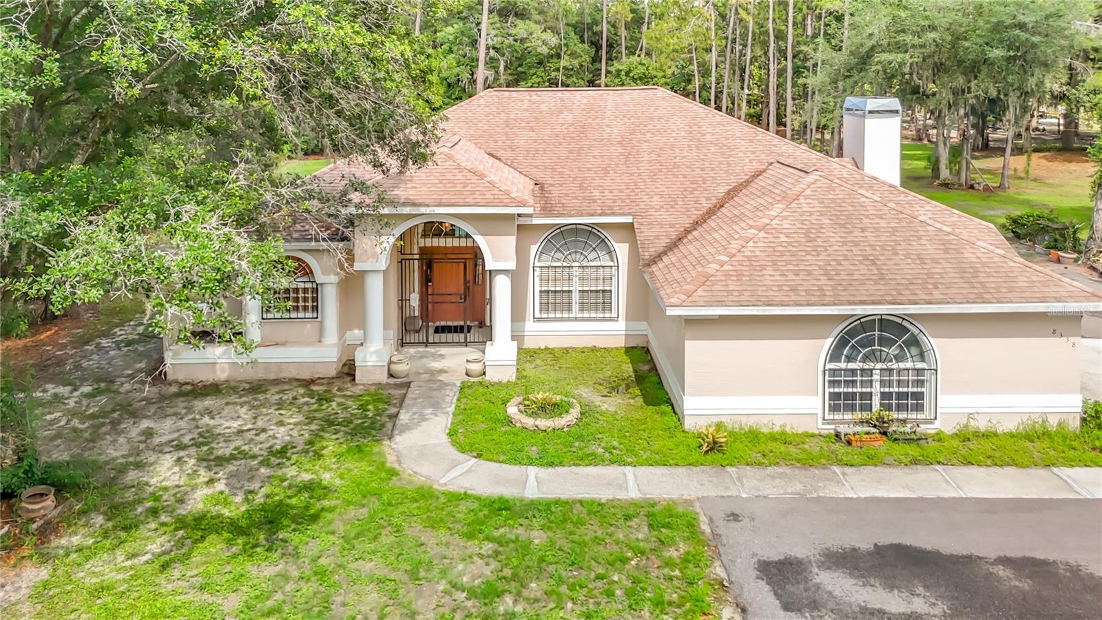 Imagine waking up each morning to the gentle sounds of nature, sipping your coffee on the screened lanai as wildlife wanders through the trees and the quiet beauty of 10 secluded acres surrounds you.

Nestled in the heart of Wesley Chapel, this charming  heated pool home offers the perfect escape from the busy world while still being close to everything you need. Designed for families dreaming of country living, there’s room here for horses , cows , chickens , and all the memories that come with wide open spaces.

Step inside to an inviting open floor plan featuring formal living and dining rooms ideal for holiday gatherings and family celebrations.   The cozy wood-burning fireplace creates the perfect setting for cool Florida evenings, while the spacious kitchen opens seamlessly to the family room, creating the heart of the home where everyone can gather together. With plenty of cabinet space for all your culinary ware , meal prep and entertaining become both functional and enjoyable. The kitchen nook overlooks the sparkling pool , making every breakfast feel like a peaceful retreat.

Outside, endless possibilities await. Whether it’s , creating gardens, riding horses at sunset, or simply enjoying the peaceful wildlife around you, this property offers a lifestyle many dream about but few ever find.

Privacy, serenity, and the beauty of country living — all right here in Wesley Chapel.
Make your private appointment today before its gone!