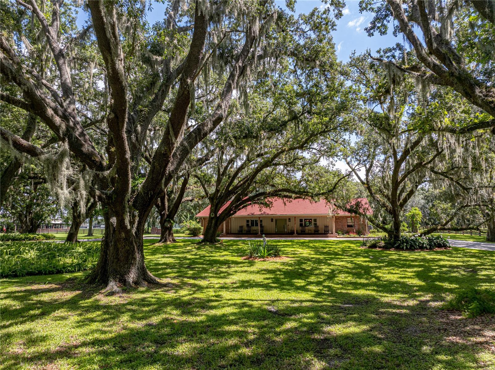 **PRICE IMPROVEMENT** This expansive 140+/- acre ranch with luxury home, stables, and arena is unlike anything found in the region. The property offers an exceptional blend of luxurious living, equestrian facilities, and working cattle ranch. The ranch features an exquisitely designed 3,648 sq ft, 3-bedroom, 3-bathroom home. The interior is complete with hardwood floors, top-of-the-line Thermador appliances, and the ultimate relaxation spot: a screened and heated swimming pool. The home features an immaculately landscaped circular drive with sprawling ancient live oaks, a brick exterior, galvanized shingle roof, and hand cut pecky cypress to accent the porch. 
The horse stables are much more than just a barn. This facility boasts 12 spacious horse stalls, a dedicated tack room, and a feed room. Uniquely integrated into the barn – a fully air-conditioned gym, perfectly compliments the amenities of the home. 
In addition to the home, stables, and 6 pastures, the property also features:
150x275 ft guardrail roping arena  – Finished in quarter rounds and featuring an announcer stand, covered roping boxes, and lights; this focal point of the property is ideal for roping, barrel races, or training horses.
80x120' cutting arena finished in quarter rounds.
Working cow pens with hydraulic chute.
Covered, state-of-the-art panel hot walker.
15 ton silo-style grain bin.
9-bay equipment barn – ample storage for all your machinery and ranch essentials.
Spacious dog kennels – perfect for working dogs or family pets.
Multifunctional outbuilding with separate well, septic, and A/C –  transform it into a private office, secondary suite, or the ultimate "man cave."