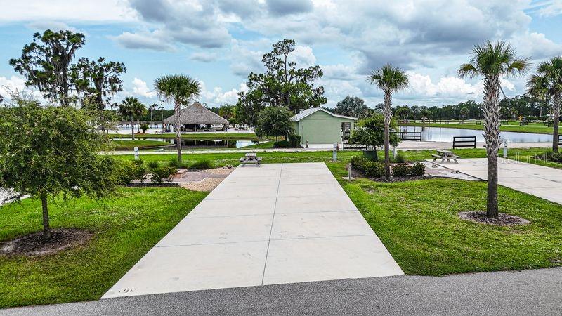 Short Sale. Welcome to Resort at Canopy Oaks, a gated luxury RV and tiny home community in Central Florida offering resort-style amenities and long-term ownership value. Residents enjoy a beautifully appointed clubhouse, heated pool and spa, fitness center, pickleball courts, dog park, and a vibrant social calendar — all set within meticulously maintained grounds.

This prime perimeter RV lot offers beautiful water and tiki bar views while maintaining easy access to the community’s amenities. Thoughtfully upgraded with a paver patio and fire pit, the lot is perfectly designed for outdoor entertaining and relaxing evenings under the Florida sky. Bring your RV or park model and start enjoying resort-style living right away.

Ownership includes deeded property within a professionally managed resort known for strong seasonal demand and rental potential. Ask about current developer incentives,

Schedule your private tour today and secure your place in this sought-after Florida resort community.