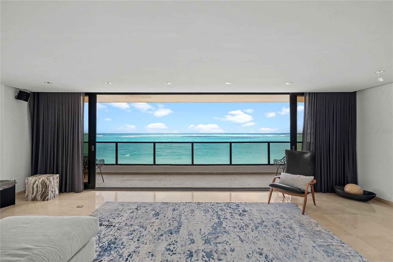 Welcome to 1 Cervantes! Introducing a rare full-floor beachfront residence in the heart of Condado, with direct ocean views and a highly functional layout in one of the most sought-after locations in the area.

The elevator opens directly into the apartment, leading to an expansive open-concept design spanning over 3,022 square feet. 1 Cervantes is one of the very few buildings in which the primary bedroom and the living, dining, and family rooms are all positioned along the beachfront side of the home. Floor-to-ceiling windows frame uninterrupted ocean vistas and fill the interior with natural light, creating a seamless connection between indoor living and the shoreline. 

The beachfront primary suite is thoughtfully separated from the secondary bedrooms, offering a comfortable retreat with ocean views and an en-suite bath. Two additional main bedrooms, a guest bedroom, two additional full bathrooms, and one half bathroom provide flexibility for guests, home office, or multi-generational living. The floor plan is designed to maximize usable space and circulation, with clearly defined living and sleeping areas.

Marble floors run throughout, contributing to a clean, cohesive aesthetic and easy maintenance in a coastal environment. The residence includes three dedicated parking spaces, a valuable convenience in Condado. Building is equipped with 24-hour security, a full power generator, and water cistern. The beach is your main amenity and a variety of gyms are walking distance.

Located in what is widely regarded as one of the best positions in Condado, this property places you directly on the beach and within short distance of schools, restaurants, shopping, and entertainment. The combination of a full-floor layout, beachfront exposure, and central Condado location makes this home well suited for both full-time living and use as a serene retreat.

This four-bedroom, three-and-a-half-bath condominium is offered for sale and presents a compelling opportunity for buyers seeking direct beachfront living, comfortable interior space, and a prime Condado address.
