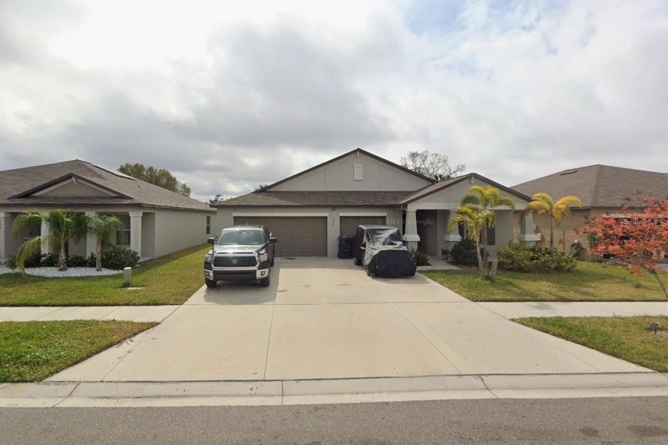 Short Sale. If you've been searching for a home with space for everyone, your search ends here! This beautifully maintained 5-bedroom, 3-bath home, built in 2021, offers over 2,600 square feet of thoughtfully designed living space and a spacious 3-car garage. As the only five-bedroom floor plan in the community, this rare home is perfect for growing families, multi-generational living, or anyone who simply wants extra room to live, work, and entertain.
A charming covered front porch welcomes you inside, where soaring 9-foot ceilings and an open, airy layout create an inviting atmosphere. The split-bedroom floor plan features two private suites, making it ideal for guests or extended family. Every bedroom is generously sized with walk-in closets and custom shelving, providing exceptional storage throughout.
The heart of the home is the expansive kitchen, designed for both everyday living and entertaining. It features an oversized island with seating, granite countertops, rich wood cabinetry, stainless steel appliances, a walk-in pantry, upgraded fixtures, and abundant cabinet space. The kitchen flows seamlessly into the spacious living and dining areas, creating the perfect place to gather with family and friends.
The primary suite has been thoughtfully enhanced for added privacy and includes a customized walk-in closet.
The oversized 3-car garage offers additional overhead storage and plenty of room for vehicles, hobbies, or a workshop. Outside, enjoy a large backyard patio with peaceful water views—an ideal setting for entertaining, grilling, or simply relaxing after a long day.
Conveniently located in the growing community of Ruskin, you'll enjoy quick access to I-75, US-41, shopping, dining, schools, parks, and the beautiful Gulf Coast. Combining space, functionality, energy efficiency, and modern design, this move-in-ready home is one you won't want to miss.