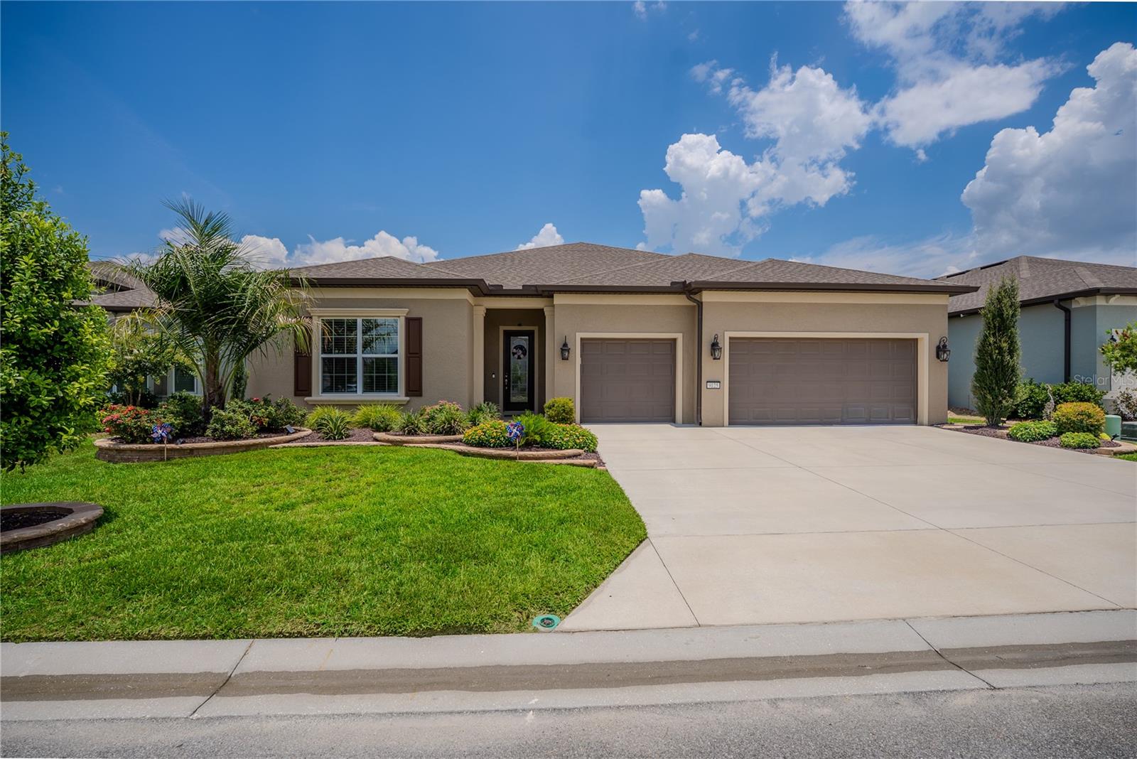 Experience luxury resort-style living in this exceptional Renown model perfectly situated on the golf course in the highly sought-after Del Webb Stone Creek community. Offering breathtaking views with no rear neighbors—not even across the golf course—this meticulously upgraded home provides the privacy and tranquility that discerning buyers are looking for.

Designed with both elegance and functionality in mind, this spacious residence features 3 bedrooms, 3.5 bathrooms, and a versatile flex room, making it ideal for a home office, hobby room, or additional living space. Rich luxury vinyl flooring flows throughout the bedrooms, while tile enhances the common areas, kitchen, and bathrooms. Custom rounded drywall corners, extensive crown molding, and beautiful custom wainscoting create a refined, upscale feel throughout the home.

The gourmet kitchen is a chef's dream, featuring built-in appliances, premium 3cm quartz countertops, a touchless faucet, a granite composite sink, a reverse osmosis water filtration system, and abundant soft-close cabinetry with rollout shelves for exceptional storage. The open-concept design flows seamlessly into the spacious extended living room, highlighted by a tray ceiling and expansive views of the outdoor living area.

Retreat to the luxurious primary suite featuring an elegant tray ceiling and a spa-inspired bathroom with a stunning floor-to-ceiling tiled walk-in shower. The well-appointed laundry room includes additional cabinetry and a utility sink for added convenience.

Step outside to your own private backyard oasis. The custom heated pool offers every luxury imaginable, including a spacious sun shelf with umbrella sleeve, two bubblers, four decorative deck jets, programmable multicolor underwater lighting, in-floor cleaning circulation jets, automatic chlorinator, automatic fill and overflow systems, and convenient wireless remote operation. Whether entertaining guests or enjoying a peaceful evening overlooking the golf course, this outdoor space is truly second to none. The fully equipped outdoor kitchen includes a propane gas grill, side burner, sink, and built-in cabinetry, while premium ceiling fans keep both the lanai and outdoor living area comfortable year-round.

Additional premium upgrades include professional landscaping with smart Wi-Fi controlled irrigation, custom front coach lights on timers, a custom glass inset front entry door, whole-house EcoWater filtration and water softener system, whole-house electrical surge protection, 1/4-inch Lexan hurricane shatter-resistant panels for the east- and west-facing windows, automatic programmable premium Levolor blinds in the family room, dining room, café, flex room, and primary bedroom, and a 240-volt outlet in the garage ready for an electric vehicle charger or RV hookup. The oversized garage also features premium vinyl flooring tiles and overhead storage, providing both style and functionality.

This extraordinary home offers the perfect combination of luxury, privacy, and thoughtful upgrades in one of Ocala's premier 55+ communities. Del Webb Stone Creek residents enjoy world-class amenities, championship golf, resort-style pools, fitness centers, pickleball and tennis courts, walking trails, numerous clubs and activities, and an active lifestyle unlike any other.

This is more than just a home—it's a luxury lifestyle waiting for you.