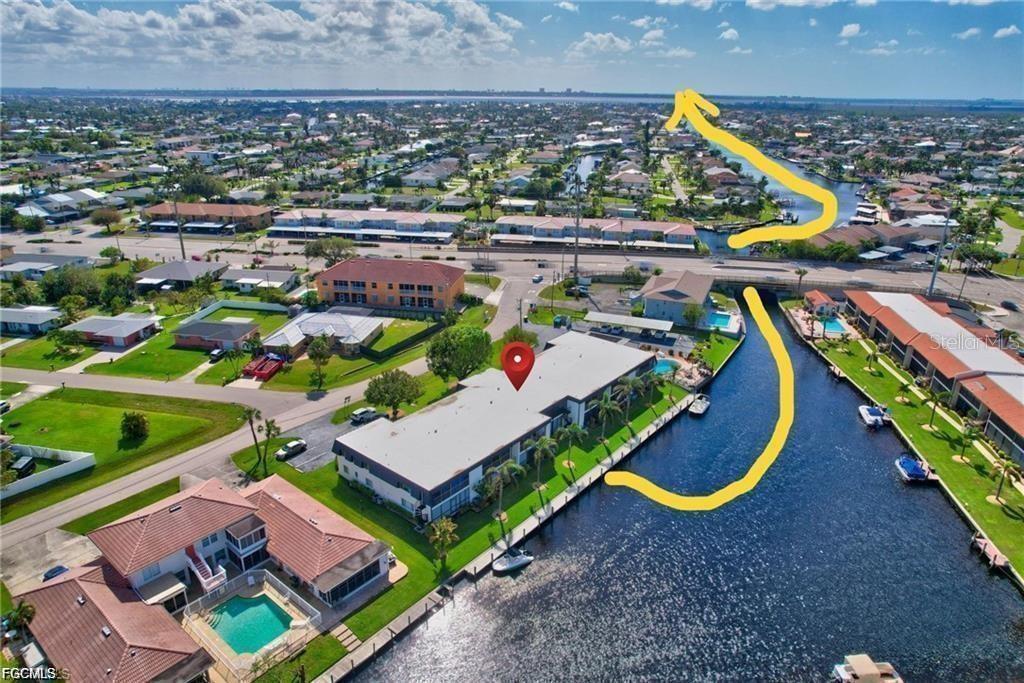 Waterfront Gulf Access Condo with approximately 7-minute access to open water! Whether you are looking for the perfect seasonal retreat or a full-time slice of paradise, this beautifully upgraded condo offers the ultimate Southwest Florida lifestyle. Spend your days boating, fishing, watching dolphins and manatees, enjoying endless outdoor activities, and relaxing with breathtaking sunset views right from your private lanai. The extensive list of NEW upgrades adds style, comfort, and value throughout the home. With up to 12 rentals allowed per year, this property also presents an outstanding investment opportunity. Ideally located near shopping, waterfront restaurants, parks, beaches, marinas, hotels, airports, and even a nearby waterpark — everything you need is just moments away. Rent a boat slip only steps from your door and enjoy quick, effortless Gulf access whenever adventure calls. Fall in love with waterfront living and make your move to paradise today!