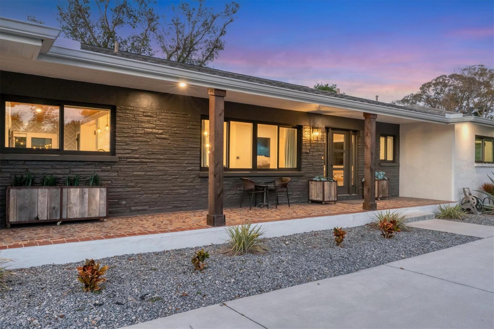 Looking for an oversized garage and storage? At 781 sf, this one may have room for everything! Welcome to this beautiful redux in the desirable South Gate community of Sarasota. Originally constructed more than 60 years ago by exceptional craftsmen, this mid-century home has been meticulously updated with a modern interpretation of the classic South Gate style. Updated electric, completely re-piped, new HVAC, and new hurricane-rated impact windows and doors are the most important updates offered here. Three new baths and a completely reimagined kitchen and dining area bring everything and everyone together. Even the landscaping has been optimized for resilience and maintenance simplicity. With a generous two-bay garage, extra parking for entertaining, privacy fencing, and an oversized lot, this home will satisfy the needs and vision of many discerning buyers, and certainly its next fortunate owner. Positioned on an elevated lot well above any flood zone, owners will rest easily, no matter what the weather brings. This extraordinary home provides all this, quality, style, modernity and safety, while being only a few minutes from everything people desire in this area. Siesta Key and downtown Sarasota, wonderful beaches and vibrant lifestyle will be the daily experience for the next owner of this fine home. Find out what life could be like for you in this special place!