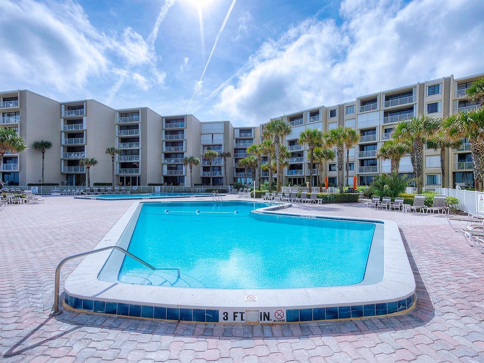 DIRECT OCEANFRONT! This Resort feel condominium complex, THE PELICAN, in New Smyrna Beach is TOP RATED for full time or part time living with easy access to shopping, restaurants, and events on Flagler Avenue. Same owner for the past 23 years made this SPACIOUS 2 BEDROOM/2 BATHROOM a second home with a beautifully appointed kitchen, Italian ceramic tile, and updated bathrooms. A walk in closet!, additional owner storage both inside and outside, new hurricane rated windows and sliders, and fresh paint make a complete package. The complex wrapped up extensive work October 2022 including concrete restoration, new roof, new railings, and deck coatings. Onsite property management and rental team. DREAM come true! ;LocationDescription: Condo ;Water: City