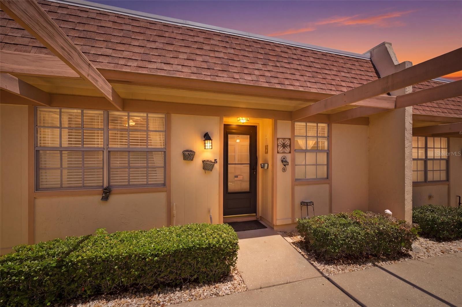 TIMBER OAKS – PEACEFUL VIEWS, RESORT-STYLE AMENITIES, AND THE FLORIDA LIFESTYLE YOU HAVE BEEN WAITING FOR!
Welcome home to this beautifully located single-story 2 bedroom, 2 bath condo in the highly sought-after Timber Oaks 55+ community in Port Richey. Offering 954 sq ft of interior living space plus a fully enclosed 144 sq ft Florida room, this home provides a total of 1,098 sq ft of comfortable Florida living.

What truly makes this home special is its exceptional setting. Instead of looking into another building, you will enjoy a wide open grassy area behind the home, creating a peaceful, private backdrop where you can relax in your Florida room, enjoy your morning coffee, and watch Florida birds and native wildlife right from home.

This condo is ideally situated just steps from a nearby neighborhood pool and clubhouse, giving you easy access to a quieter gathering space close to home, while also enjoying full access to Timber Oaks’ impressive main amenities. Residents enjoy a resort-style heated pool and spa, expansive clubhouse, walking trails, sports courts, and endless social activities including cards, pool, sewing, arts and crafts, library access, dances, breakfasts, clubs, and so much more.

Inside, the home offers comfortable living with added convenience, including an in-unit stackable washer and dryer, while residents also have access to a community coin-operated laundry facility for additional flexibility.

Additional features include one covered parking space with private outdoor storage, plus the convenience of two guest parking areas located just steps from the home.

When you are ready to explore beyond the community, you are just a short drive from the Gulf Coast’s favorite destinations including Hudson Beach, Green Key Beach, Fred Howard Park, Sunset Beach, and Clearwater Beach, making sunset walks, waterfront dining, and beach days always within reach.

Maintenance fees include water, sewer, cable, internet, trash, exterior maintenance, roof, insurance, pool, and grounds care—making for easy, low-maintenance living.

Peaceful views, active amenities, and an unbeatable Florida lifestyle—do not miss this one!