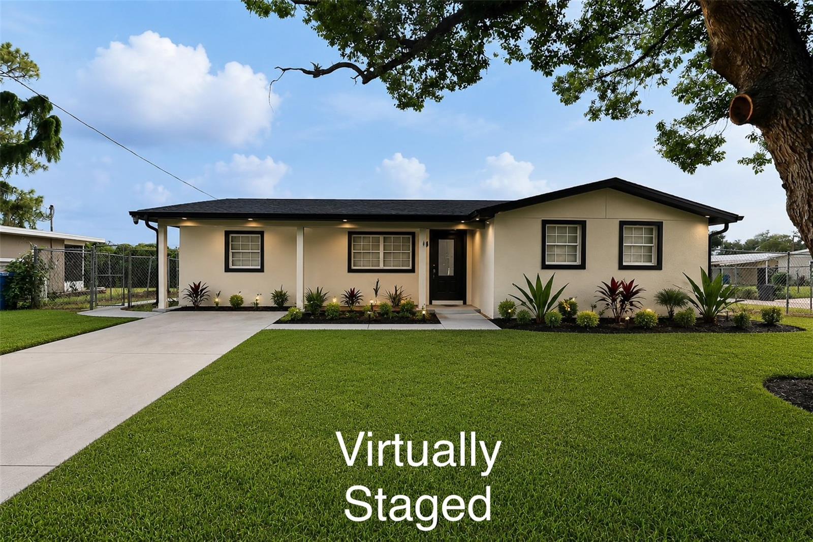 Virtually Staged. Welcome to this Charming 4-bedroom and 2-bath Corner-Lot block home situated on a fully fenced backyard—perfect for entertaining, pets, gardening, or creating your dream outdoor oasis. A magnificent mature shade tree enhances the property's curb appeal and provides a peaceful setting to enjoy Florida living. 
Inside, you'll find a bright and inviting layout filled with natural light and designed for comfortable everyday living. The home's neutral exterior, updated roof, and clean landscaping deliver excellent curb appeal. At the same time, the expansive yard offers endless possibilities for future additions (see staged images), such as a pool, patio, workshop, or outdoor kitchen! 

Property Highlights:
Completely renovated block home
Spacious corner lot with excellent curb appeal
Large, fenced backyard with plenty of room to play or entertain
Beautiful mature shade tree
Bright, functional floor plan
Brand new roof
Ideal for first-time buyers, families, or investors
Conveniently located near schools, shopping, dining, parks, and major roadways

Whether you're looking for your first home or your next investment opportunity, this property offers comfort, space, and endless potential. Don't miss your chance to own this charming home—schedule your private showing today!