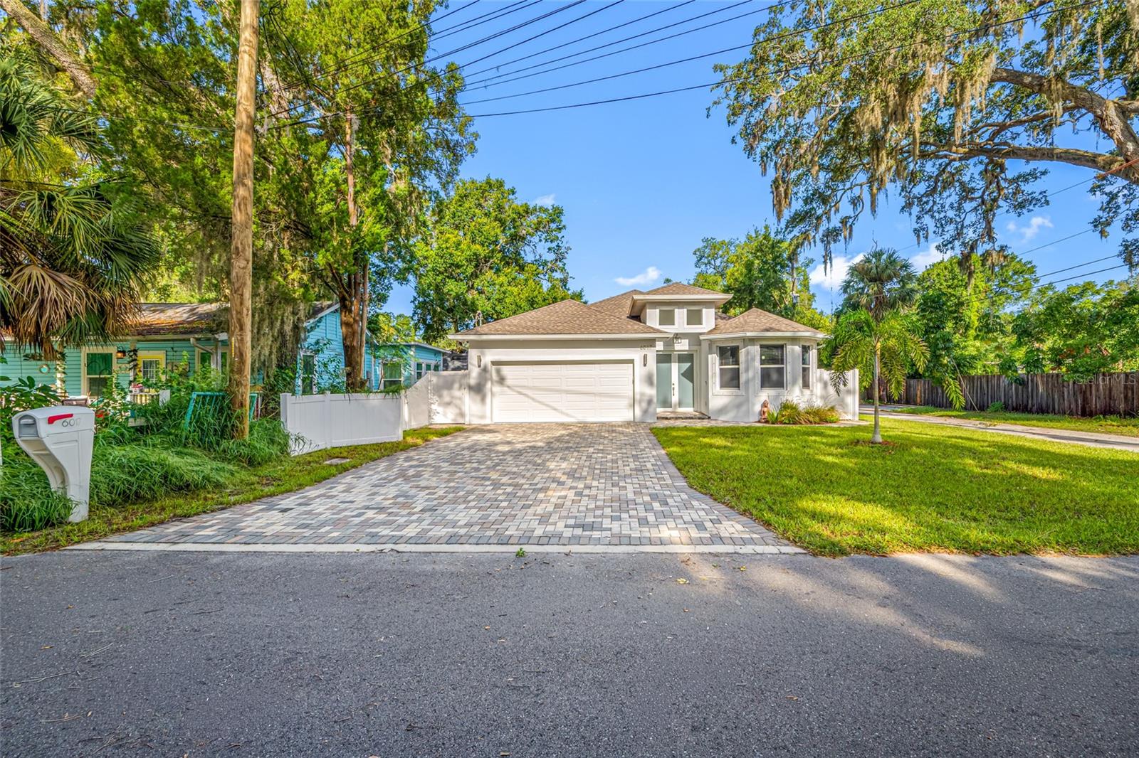 Welcome to this beautifully maintained, 5-year-new home located just a few blocks from the heart of Downtown New Port Richey! Enjoy the ultimate Florida lifestyle with the ability to walk, bike, or take your golf cart to the city's vibrant restaurants, breweries, festivals, waterfront parks, boutique shopping, and entertainment.
Step through the impressive double-door entry into a thoughtfully designed home featuring soaring 8-foot doors throughout, three spacious bedrooms, three full bathrooms, and a two-car garage. Two of the bedrooms offer private en-suite baths, making this an ideal layout for guests or multi-generational living.
The open-concept kitchen is designed for both everyday living and entertaining, showcasing 42-inch wood shaker cabinetry, granite countertops, stainless steel appliances (including a stove that's only one year old), a large breakfast bar, and a spacious dining area filled with beautiful natural light.
The inviting family room features surround sound, creating the perfect space for movie nights or entertaining family and friends. A dedicated indoor laundry room adds convenience to daily living.
Retreat to the luxurious primary suite featuring dual walk-in closets, separate his-and-her vanities, a relaxing freestanding soaking tub, and a large walk-in shower.
Step outside to enjoy the screened lanai overlooking the fully fenced backyard—perfect for pets, children, or simply relaxing outdoors.
Best of all, this home is located in a non-flood zone, providing added peace of mind. With its newer construction, modern finishes, exceptional floor plan, and unbeatable location just moments from everything Downtown New Port Richey has to offer, this is a home you won't want to miss!