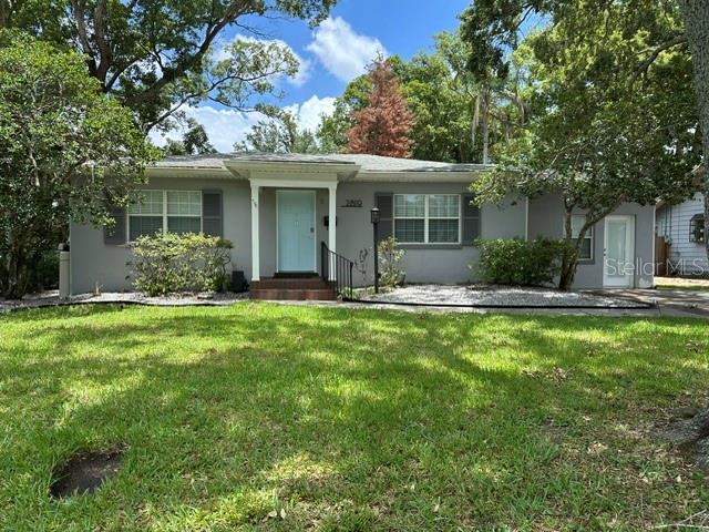 Welcome to this beautifully updated College Park pool home, where classic 1950s charm meets modern comfort and style. Offering 1,240 square feet of living space, this 2-bedroom, 1.5-bath residence has been thoughtfully renovated and is move-in ready.

Inside, you'll find gorgeous original hardwood floors, crown molding, and updated lighting.  The spacious living and dining areas flow seamlessly into the renovated kitchen, featuring quartz countertops, white cabinetry, stainless steel appliances, designer tile backsplash, and abundant storage and prep space.

The primary bathroom has been completely updated with a frameless glass walk-in shower, contemporary vanity, and custom tile finishes. A stylishly renovated half bath adds convenience for guests. Both bedrooms offer hardwood flooring and ceiling fans.

One of the home's standout features is the versatile bonus living area, ideal as a home office, reading room, fitness space, or additional entertainment area. A separate laundry and utility room provides excellent storage and functionality.

Step outside to your private backyard retreat featuring a screened-in pool and spa, creating the perfect setting for year-round Florida living. The fully fenced yard offers privacy while the mature landscaping and towering shade trees enhance the property's charm and curb appeal.

Located in one of Orlando's most desirable neighborhoods, this home places you just minutes from College Park's popular restaurants, boutiques, parks, downtown Orlando, AdventHealth, and major commuter routes.

Combining updated interiors, a private screened pool, flexible living spaces, and an exceptional College Park location, this home offers a rare opportunity to enjoy the best of Central Florida living.