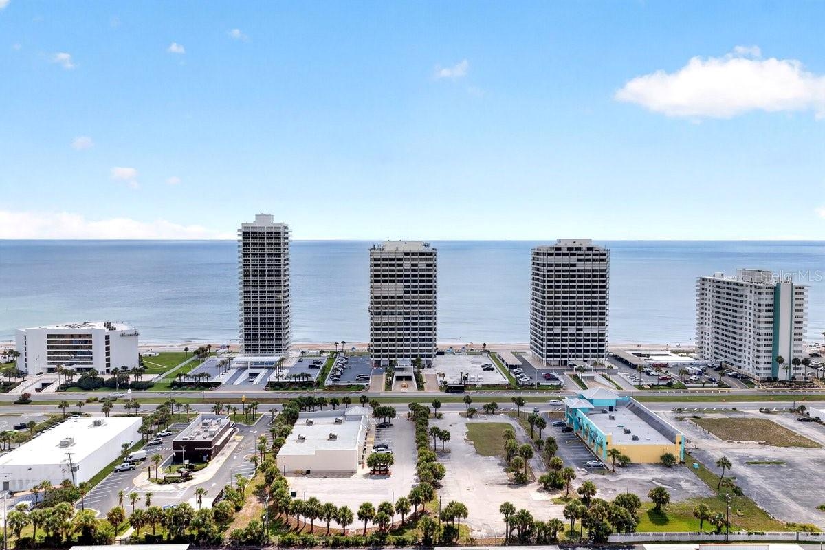 *ENJOY OCEANFRONT LIVING AT ITS BEST AT THE OCEAN RITZ! GORGEOUS REMODELED 2-BEDROOM 2-BATH 10TH FLOOR END UNIT SKY HOME OFFERING BREATHTAKING PANORAMIC VIEWS OF THE ATLANTIC OCEAN & THE INTRACOASTAL WATERWAY. SIT BACK, RELAX & TAKE IN MAJESTIC SUNRISES & SUNSETS FROM MORE THAN 400 SQUARE FEET OF PRIVATE WRAP-AROUND BALCONY SPACE. IMPRESSIVE EXTENDED FOYER LEADS YOU TO SPACIOUS OPEN LIVING ROOM ACCENTED BY FLOOR-TO-CEILING GLASS WINDOWS & SLIDERS, GORGEOUS LUXURY VINYL FLOORING, RE-FINISHED CEILINGS, CUSTOM FANS, WAINSCOTING/TRIMWORK, & NEWER INTERIOR PAINT. REMODELED GOURMET KITCHEN FEATURES WOOD CABINETRY, GRANITE COUNTERS, TOP OF THE LINE LG-APPLIANCES INCLUDING MICROWAVE/AIR-FRYER, SMART STOVE, COUNTER-DEPTH REFRIGERATOR, NEWER 3-TIER DISHWASHER & CABINET PANTRY. PERFECT SPACE FOR FORMAL OR CASUAL DINING! PRIMARY EN-SUITE CREATES A PEACEFUL RETREAT W/GORGEOUS RIVER VIEWS & TRIPLE SLIDER ACCESS TO PRIVATE BALCONY. SEPARATE VANITY/DESK AREA, TWO CLOSETS, SECURE HALLWAY EXIT DOOR

AND REMODELED FULL BATH W/TILED WALK-IN SHOWER & ACCENT LIGHTING. SPACIOUS GUEST BEDROOM W/NEW CLOSET DOOR, DEORATIVE NOOK W/GLASS SHELVING & TRIPLE WINDOW SLIDER ACCESS TO BALCONIES. REMODELED FULL GUEST BATH W/NEWER VANITY, CUSTOM FAUCET-SPRAYER, EXTRA CABINET SPACE, FLOOR TO CEILING TILE IN TUB/SHOWER W/SHOWER HEAD FILTER. UNIT ALSO INCLUDES UTILITY CLOSET WITH WASHER/DRYER HOOKUP, ELECTRIC STORM SHUTTERS, WINDOW SCREEN SHADES, TWO ADDITIONAL HALLWAY NICHES W/DECORATIVE GLASS SHELVING & CABINET SPACE, NEWER HOT WATER HEATER W/DRIP PAN, UPDATED ELECTRICAL OUTLETS, DIMMERS, NEWER KITCHEN TILE, ACCENT LIGHTING, DOOR MAGNETS TO AVOID SLAMMING & CONVENIENTLY LOCATED SHARED FLOOR LAUNDRY ROOM. GREAT ON-SITE AMMENITIES INCLUDE: OCEANFRONT CLUB ROOM W/FULL KITCHEN FOR YEAR-ROUND ACTIVITIES OR RESERVE FOR A PRIVATE CELEBRATION, HEATED OCEANFRONT POOL & SUN DECK, FITNESS CENTER, SECURED DIRECT BEACH ACCESS, GREEN SPACE, UNDERGROUND PARKING & ON-SITE MANAGEMENT. CONVENIENTLY LOCATED IN NORTH DAYTONA BEACH NEAR ORMOND BEACH... SHORT DRIVE TO DAYTONA INTERNATIONAL SPEEDWAY AND DAYTONA INTERNATIONAL AIRPORT.