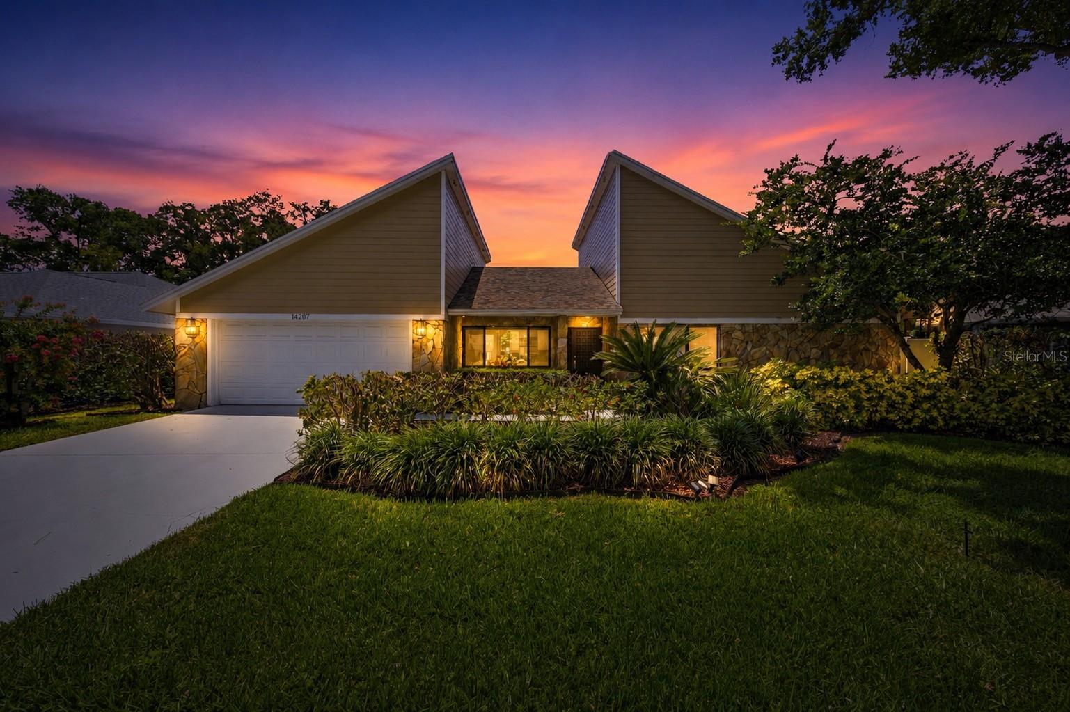 Welcome to this beautifully renovated pool home in the highly desirable golfing community of Carrollwood Village. This block construction residence offers outstanding curb appeal with mature landscaping. Some of the updated features include- newer Hardie Board siding, a new roof (2022), a new A/C system (2026), resurfaced pool and spa (2026), variable-speed pool pump and a 240V EV charger. Inside, you'll find a spacious split-bedroom floor plan with updated flooring throughout. The beautifully appointed kitchen features wood cabinetry, granite countertops, decorative backsplash, breakfast bar and updated appliances. The adjoining great room is truly the centerpiece of the home, showcasing vaulted ceilings, a wood-burning fireplace, wet bar, abundant natural light and newly installed skylights. The private primary suite offers direct access to a heated in-ground spa and features an updated en-suite bath with dual vanities, granite countertops, walk-in shower and a custom walk-in closet with built-in organizers. A versatile bonus room connected to the primary suite provides the perfect space for a home office, nursery, fitness room or YOUR DREAM CLOSET (currently set up this way) The secondary bedrooms, guest bath and utility room with additional storage are thoughtfully situated on the opposite side of the home, providing privacy and functionality. Designed for Florida living, the outdoor space is ideal for both entertaining and relaxation. The centrally located pool and outdoor kitchen are easily accessible from multiple areas of the home, creating a seamless indoor-outdoor lifestyle. Enjoy the impressive 8-foot-deep pool with diving board, unwind beside the decorative rock waterfall or relax in the heated spa. The large vinyl-fenced backyard offers plenty of room for pets, play and outdoor gatherings. Carrollwood Country Club features 27 holes of championship golf, tennis courts, fitness facilities, resort-style swimming pools and clubhouse dining. The community also offers an exceptional park with walking and jogging trails, fitness stations, dog parks, splash areas, covered pavilions and restrooms. Conveniently located near shopping, dining, Busch Gardens, Adventure Island, highly rated schools, I-275, and the Veterans Expressway. Tampa International Airport is less than 15 minutes away, and Florida's beautiful Gulf Coast beaches can be reached in approximately 30 minutes. Move-in ready and loaded with upgrades, this exceptional home combines comfort, style and an unbeatable location. Schedule your private showing today.
