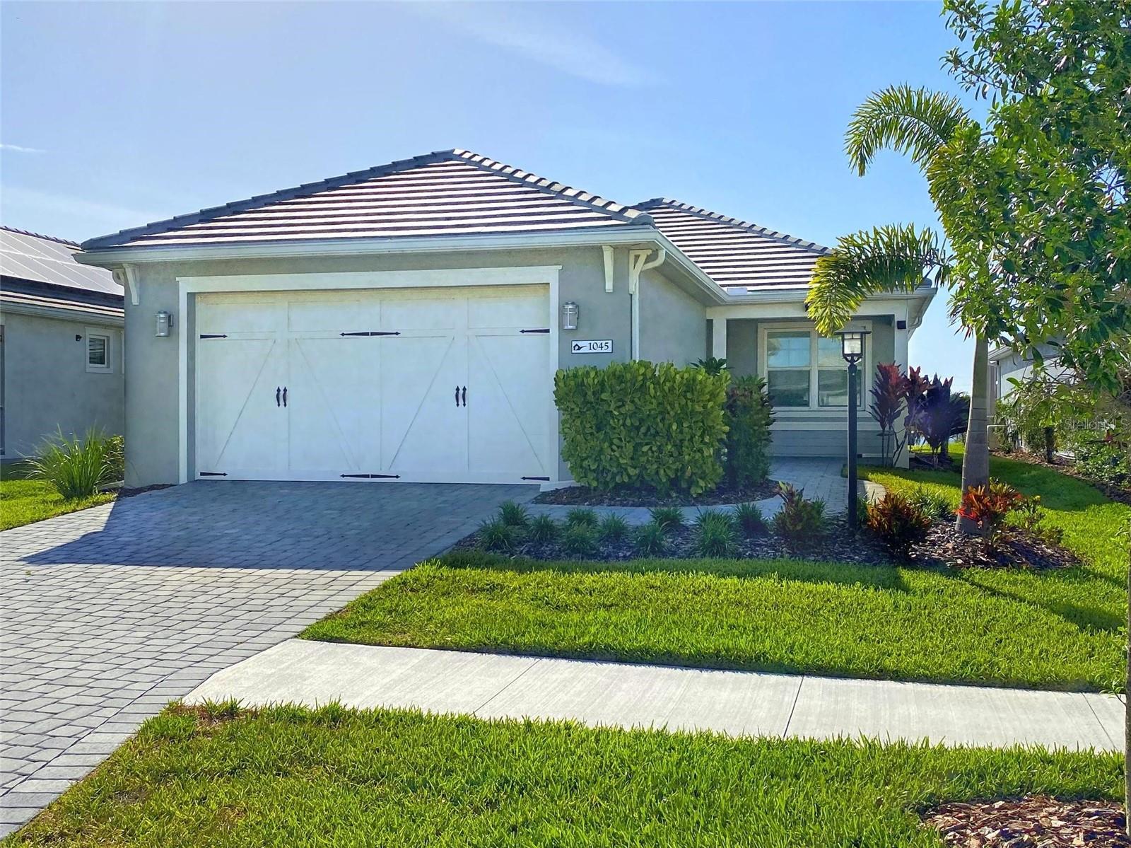 This Furnished 2 Bedroom, 2 Bath with Den Lake View Home in the Lakehouse Cove Resort Community. This home is available furnished, however it can be unfurnished upon request. This split floor plan home features a large great room with Tray Ceiling and Sliders to the Lanai. The kitchen features stainless steel appliances, a large island and Quartz countertops. The master suite has a walk-in closet, dual vanities and glass shower in the master bath.  The second bedroom is located the furthest from the master suite for privacy. The large Den works well as a home office or hobby room. The furnishings in the photos are available to be placed back in the property. The 7-Acre Amenity Center features a Resort Style Pool Overlooking Kingfisher Lake, a Boat House with Kayak Launch, Club House & Event Lawn, A Separate Fitness Center, Tennis Courts, PickleBall Courts, Bocce Courts, and Two Dog Parks. Lakehouse Cove is only minutes to Lakewood Ranch Main Street, Benderson Park, several golf clubs, University Town Center Mall, medical facilities, and downtown Sarasota. Please allow 37 days after approval before move-in for the HOA to process their application. No vehicles with commercial labeling or recreational vehicles allowed to be parked overnight outside the garage. Please be aware that leasing this property includes a non-optional Home Assistant Services Package that will cost an additional $30 per month. These services and their cost are separate from Tenant’s monthly rent payment and all other payments described in the Lease or any separate Lease addendums. The Home Assistant Services offered are described in the Resident Welcome Packet which can be viewed here: www.sarasotamanagement.com/home-assistant/