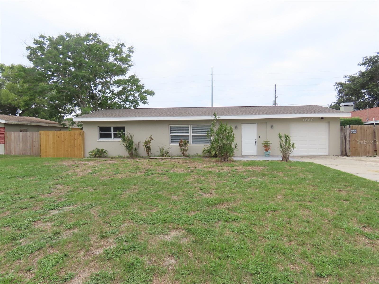 Fresh updates and a spacious homesite come together at 1660 Jefferson Avenue S in Clearwater! This 3-bedroom, 2-bath home features a new roof, fresh interior and exterior paint, and new carpet in the bedrooms, offering a clean and refreshed feel ready for its next owner. The functional floor plan provides comfortable everyday living, while the attached 1-car garage and storage shed add practical space for hobbies, tools, or additional storage needs.

Step outside to discover one of the property’s standout features — the oversized fenced backyard. With ample room for a future pool, outdoor kitchen, entertaining patio, firepit area, garden beds, play space, or additional recreational uses, the possibilities are extensive. Whether you envision relaxing evenings outdoors, creating a private backyard retreat, or expanding the outdoor living space, this property offers the flexibility to make it your own.

Conveniently located near Clearwater’s renowned Gulf beaches, including Clearwater Beach and Sand Key Park, residents can enjoy white sand beaches, waterfront parks, and outdoor recreation opportunities just a short drive away. Nearby recreational options also include Crest Lake Park and Edgewater Drive Park, offering walking trails, open green space, waterfront views, and outdoor activities. The home also offers convenient access to Downtown Clearwater, Downtown St. Petersburg, Tampa, shopping, dining, entertainment venues, and both Tampa International Airport and St. Pete–Clearwater International Airport. Clearwater Beach is approximately 7 miles away, Downtown St. Petersburg is approximately 20 miles away, and Downtown Tampa is approximately 25 miles away.

This property presents an excellent opportunity for buyers seeking indoor comfort, outdoor potential, and a location close to many of the Tampa Bay area’s most popular destinations and recreational attractions. All information is believed to be accurate but is not guaranteed. Buyers and agents to verify all facts pertinent to their purchase decision.