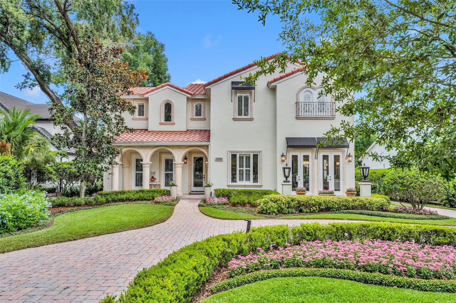 Don't miss this unique opportunity to live on one of Winter Park's most sought-after streets, on the fairway of the WP-9 Golf Course. Just steps from Park Avenue, this custom home offers 4,360 SF of living space with a detached 373 SF casita.
Meticulously maintained, recent updates include fresh landscaping (2023-2024), landscape lighting (2022), a new pool pump (2023), a new spa/pool heater (2024), newer HVAC units (2 in 2020), newer water heaters (2024 & 2021), new light fixtures (2024), and new carpet in 3 bedrooms (2024).
This 4 bed/4.2 bath Mediterranean home welcomes you with a charming, covered front porch and stunning views across the 3rd fairway and beyond. Enjoy seamless outdoor entertaining in the private backyard with a covered lanai, summer kitchen, swimming pool, and heated spa, plus an air-conditioned casita/flex space (currently an office) with a ½ bath.
Inside, the exceptional floor plan, accented by exquisite and detailed craftsmanship, offers a living/dining room combo, both flooded with natural light with great views of the golf course, a spacious family room flowing into the open kitchen with an eat-in bar and a sunny dinette area, and a private office. 
The primary suite features hardwood floors and pool views with direct access to the covered patio, plus an updated bathroom with a spacious, zero-entry glass shower, and 2 large walk-in closets with custom built-ins. Upstairs are 3 additional bedrooms, 3 full bathrooms, a loft space, and a large bonus room. 
The front circular brick drive offers plenty of guest parking, while a driveway leads around to the rear-facing, oversized 2-car garage, with a covered breezeway connecting it to the main house. 
Located just 2 blocks from Downtown Park Avenue, and boasting a 16,000 sq ft lot (192x83) and prime golf course frontage, the perfect blend of functionality and lifestyle awaits!