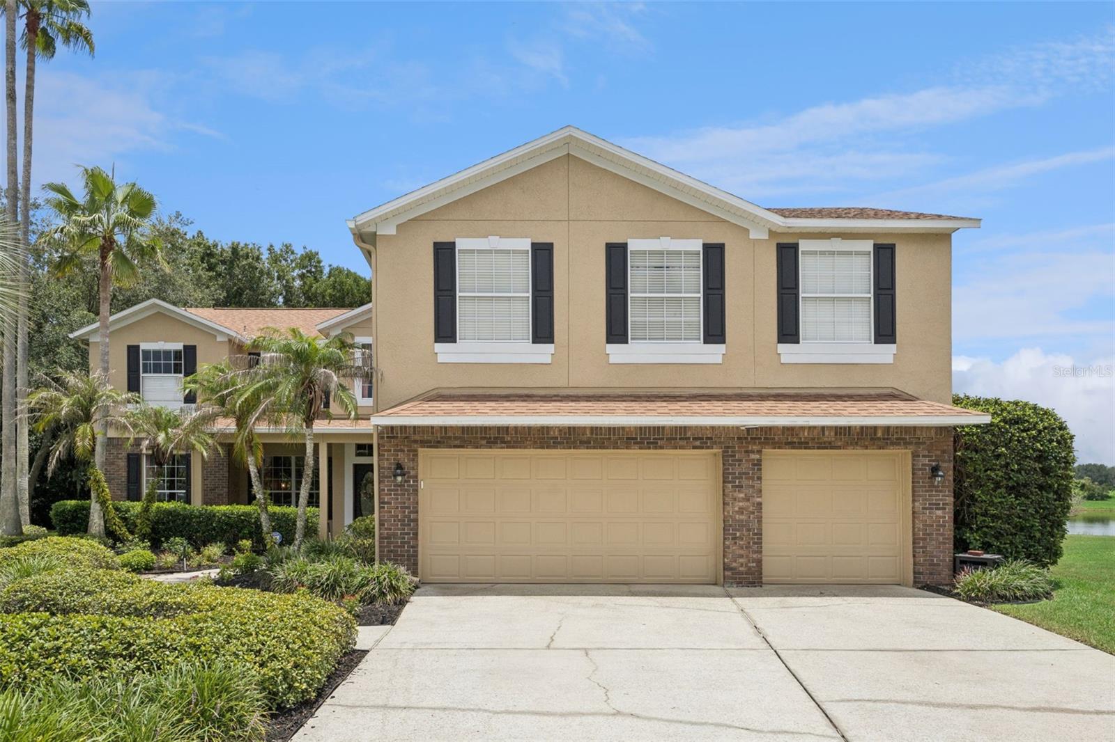 Nestled on a quiet cul-de-sac in Oviedo's desirable gated community of Chapman Lakes, this exceptional 5-bedroom, 4-bathroom pool home with a bonus room, office, and 3-car garage offers the perfect blend of luxury, comfort, and breathtaking natural surroundings. Boasting picturesque pond and conservation views, this move-in-ready home welcomes you with mature landscaping, an extended driveway, and a charming front porch.

Inside, you'll find neutral paint, wood-look tile flooring, updated lighting fixtures, and an abundance of natural light throughout. A soaring two-story foyer creates an impressive first impression and is flanked by a formal living room with a large front-facing window that flows seamlessly into the spacious formal dining room with convenient access to the kitchen—an ideal layout for entertaining.

The foyer opens into the heart of the home, where the expansive great room showcases tranquil pond and conservation views through sliding glass doors that seamlessly connect the indoor living space to the outdoor patio. The great room features a spacious family room with a cozy wood-burning fireplace, a beautifully remodeled kitchen, a sunny dinette, and a stylish dry bar complete with a wine refrigerator. Designed with both function and style in mind, the kitchen offers a large center island with seating and storage, ample countertop space, tile backsplash, stainless steel appliances, including flex-duo oven and convection microwave, floating shelves, double pantries, and a large window overlooking the pool deck.

A secondary bedroom and full bathroom are conveniently located on the first floor, providing flexible space for guests, multi-generational living, or a private home office. The custom-remodeled laundry room is equally impressive with barn doors, stackable washer and dryer, generous folding counter, and abundant storage.

Upstairs, the oversized primary suite serves as a true retreat, complete with a spacious sitting area, two walk-in closets, and a private screened balcony where you can enjoy peaceful pond and conservation views. The luxurious en-suite bathroom features a double-sink vanity, relaxing garden tub, and oversized walk-in shower.

Three additional upstairs bedrooms are generously sized with large closets and ceiling fans. Two bedrooms share a spacious bathroom with oversized, single-sink vanity and shower/tub combination, including one bedroom with direct access. The final bedroom shares a Jack-and-Jill bathroom with the expansive bonus room, making it ideal for guests or older children.

The oversized bonus room offers endless possibilities as a game room, home theater, fitness room, or media lounge, complete with a wet bar, dedicated office area, and a large storage closet perfect for holiday décor and seasonal items.

Step outside to your own private backyard oasis. The expansive pool deck is designed for entertaining, with plenty of room for summer barbecues, pool parties, and outdoor dining. The spacious pool overlooks the serene pond and conservation area, creating a peaceful backdrop for relaxing evenings. Additional green space provides room for pets to play, outdoor activities, or simply enjoying the beautiful Florida weather.

Perfectly situated in one of Oviedo's premier gated communities, this remarkable home offers an exceptional combination of space, thoughtful updates, and stunning waterfront views—making it the ideal place to call home.