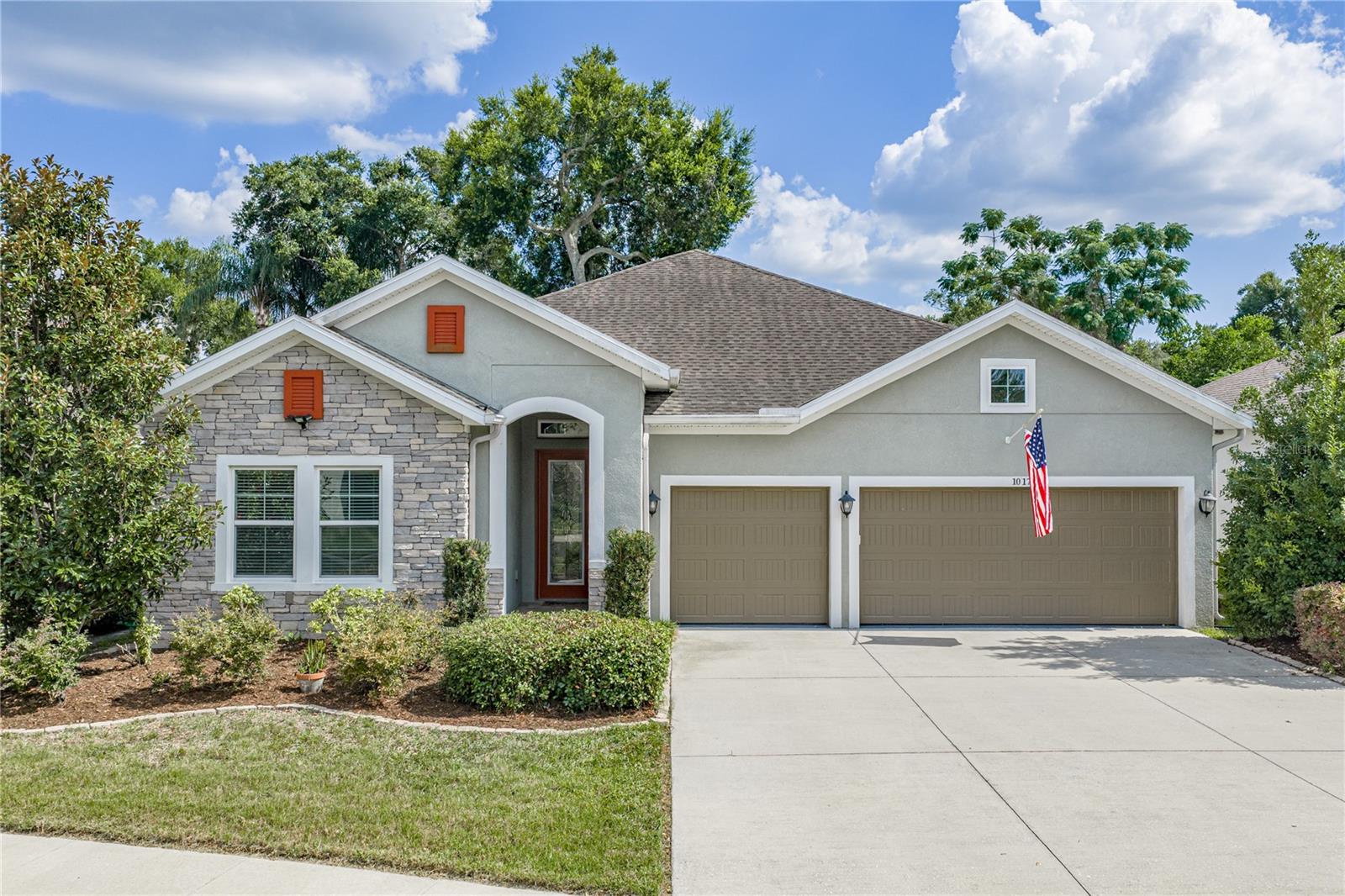 Welcome to 1017 Tracey Ann Loop, an exceptional David Weekley Home located within the prestigious gated community of Reserve at Hunters Lake. Offering the perfect blend of elegance, comfort, and thoughtful design.This beautifully maintained residence features 4 bedrooms, 3 full bathrooms, a guest bath, separate laundry room, a 3-car garage with extra long driveway, low quarterly HOA fees of just $360, and no CDD fees.cDesigned with a desirable split-bedroom floor plan, the home welcomes you with soaring vaulted ceilings, abundant natural light streaming through oversized windows, and an open-concept layout ideal for both everyday living and entertaining. Architectural details throughout include tray ceilings, crown molding, 5.5-inch baseboards, decorative niches, square columns, and a granite buffet, creating timeless sophistication at every turn. The gourmet kitchen is the heart of the home, showcasing granite countertops, a spacious center island, 42-inch espresso cabinetry with wrought iron hardware, a stylish tile backsplash, stainless steel appliances, an electric cooktop, built-in oven, and microwave—perfectly designed for both casual meals and hosting family and friends. The expansive living and dining areas seamlessly extend through sliding glass doors to the huge screened in lanai with access to its on restroom. This oversized backyard offers plenty of space to enjoy. Privately situated, the luxurious owner's suite serves as a true retreat with picture windows, tray ceilings, a generous walk-in closet, and a spa-inspired en-suite bath featuring dual vanities, and a separate walk-in shower. Reserve at Hunters Lake offers residents a peaceful, well-maintained community with a gated entrance, dog park, tot lot. Nestled within are three picturesque ponds residents enjoy a peaceful lifestyle while remaining conveniently close to shopping, dining, top-rated schools, parks, and major commuter routes. David Weekley renowned craftsmanship and energy-efficient construction, this home offers lasting quality and exceptional value. Nestled within a quiet, intimate gated community, residents enjoy a peaceful lifestyle while remaining conveniently close to shopping, dining, top-rated schools, parks, and major commuter routes. Experience refined Florida living at its finest—schedule your private showing today and discover everything this remarkable home has to offer.