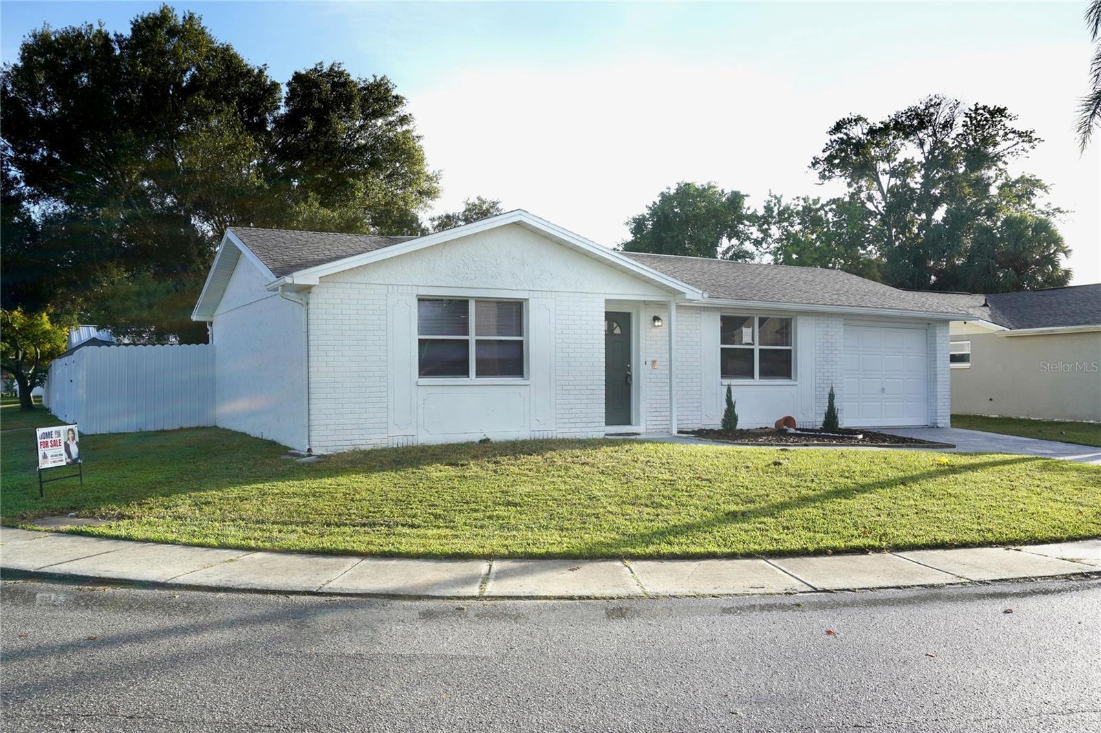 RENOVATED & PRICED BELOW APPRAISAL! This "As-Is" home offers incredible value and instant equity with a recent appraisal in hand at $240,000. Highly motivated seller is offering a 3% concession toward buyer closing costs!
The Home: Features a bright living room, kitchen with breakfast area, and two well-distributed bathrooms (one featuring direct garage and interior access).
Bonus Space: Fully air-conditioned garage with existing A/C ducts—perfect for an easy conversion into a 3rd bedroom, home gym, or office.
The Lot: Corner lot with sidewalks, covered parking, and no HOA. Features a rear gate entrance perfect for parking a boat, truck, jet ski, or commercial vehicle.
Location: Unbeatable convenience! 1 minute to shopping, 2 minutes to U.S. 19 & Home Depot, and just 10 minutes to the beach.