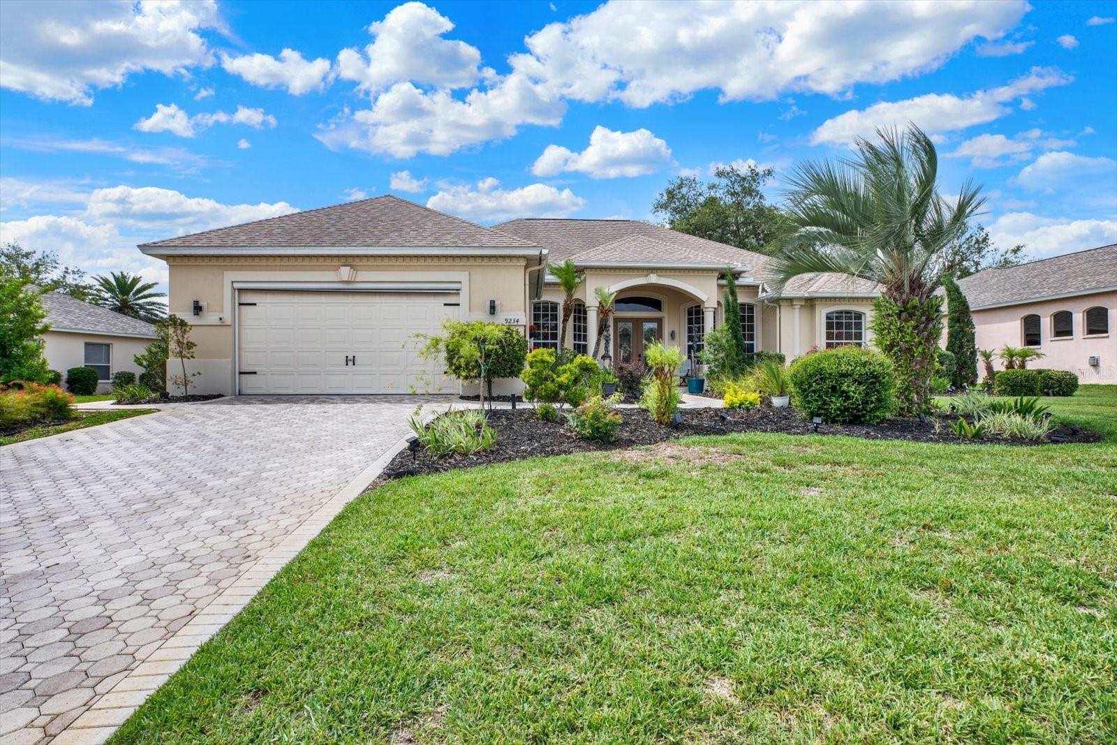 Welcome home to this exceptional Addison Homes model located in the highly sought-after GlenLakes Golf & Country Club community. This beautifully maintained 3-bedroom, 3-bath residence offers a versatile flex room perfect for a home office, den, hobby room, or guest space. This beautifully maintained 3-bedroom, 3-bath residence offers a versatile flex room, perfect for a home office, den, hobby room, or guest space.  From the moment you enter through the elegant double glass doors, you'll be captivated by the breathtaking resort-style pool views. Architectural details abound, including soaring tray ceilings, decorative columns, crown molding, recessed accents, and an open, light-filled floor plan. Wood flooring enhances the living, dining, and flex spaces, while large tile flooring is featured throughout the kitchen and wet areas.  Designed for seamless indoor-outdoor living, triple pocket sliding doors open to an expansive covered lanai and screened enclosure featuring a sparkling free-form pool with a stacked-stone waterfall. The solar-heated pool, enhanced with an electric heater and a Diamond Brite finish completed in 2018, can be enjoyed year-round.  The spacious primary suite serves as a private retreat with a sitting area, dual walk-in closets, direct pool access, and a luxurious ensuite bath featuring a garden tub, glass block shower, bidet, and separate water closet. The third bedroom includes built-in Murphy beds that convey with the home, while the third full bath provides convenient access from the pool area.  Additional highlights include abundant storage throughout, a new roof (2020), paver driveway, oversized climate-controlled garage with its own A/C system, air filtration system, and durable epoxy flooring. Enjoy the Florida lifestyle with 24-hour gated security and access to outstanding community amenities, social activities, golf, dining, and recreation. Conveniently located near shopping, restaurants, medical facilities, Pine Island Beach Park, boat ramps, biking trails, and more.