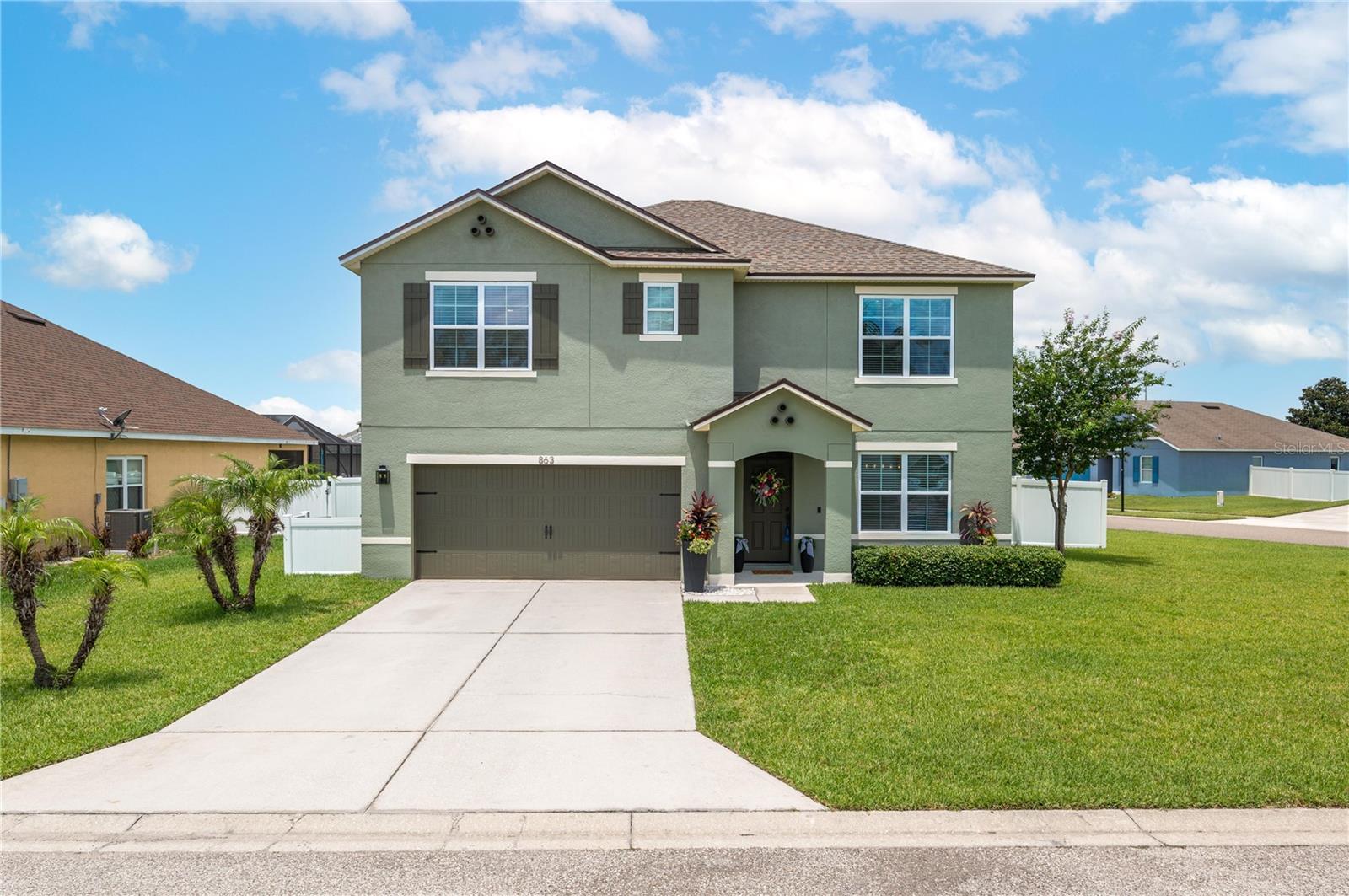 FANTASTIC PRICE + AMAZING VALUE IN THE GATED COMMUNITY of LAKE CUMMINGS ESTATES! Featuring a NEW ROOF (DEC-2024) and NEW HVAC SYSTEM (JAN-2026) for added peace of mind and energy efficiency, this beautifully remodeled 5-bedroom, 3-bath home is perfectly situated on a spacious corner lot near a quiet cul-de-sac. Residents also enjoy exclusive access to a PRIVATE BOAT RAMP, DOCK, and BOAT PARKING—perfect for boating, fishing, and enjoying the Florida lifestyle. FRESH NEWLY REMODELED AND PROFESSIONAL EXTERIOR paint. Inside you will find fresh interior paint, luxury vinyl plank flooring, updated lighting, modern molding, and stylish designer finishes throughout. The UPGRADED gourmet kitchen features stunning NEW GRANITE COUNTERTOPS, stainless steel appliances, modern backsplash, oversized island with bar seating, eat-in dining area, and a large walk-in pantry—all opening seamlessly to the main living space. A first-floor bedroom and full bath provide the perfect setup for guests, multigenerational living, or a home office. Upstairs, the spacious primary suite features dual granite vanities, a large walk-in shower, custom closet built-ins, and a relaxing private retreat feel. Three additional bedrooms and a versatile bonus room offer endless possibilities for a media room, office, playroom, or second living space. Step outside to enjoy the screened lanai with pergola, fully fenced backyard, double gate access for boat or RV storage, and plenty of room to entertain or create your own backyard oasis. Conveniently located near shopping, restaurants, medical facilities, Mackay Gardens and Lakeside Preserve offers nature trails, a canoe launch, and a lakeside park , while Lion’s Park is another great spot freshwater fishing and the waters of Lake Alfred itself . Easy access to Orlando, Tampa, Disney, LEGOLAND, and Florida’s beautiful beaches—this home truly offers the Florida lifestyle buyers dream about! Don’t miss this incredible Florida lifestyle opportunity!