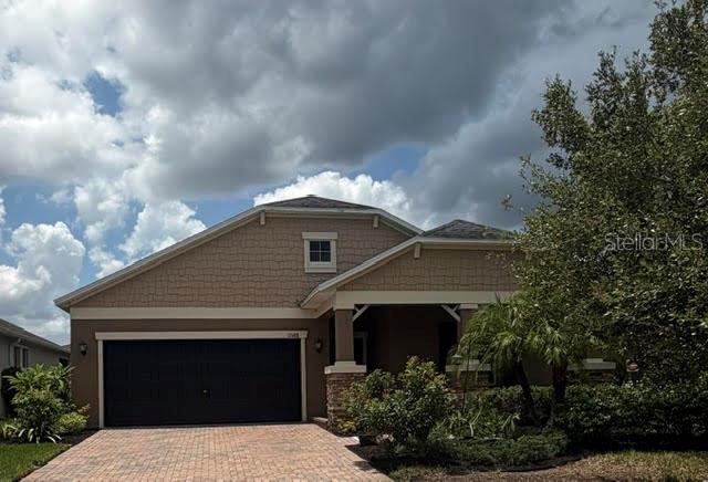 Welcome to your dream home in Bexley, one of Pasco County’s most sought-after communities! This beautiful 4-bedroom, 3-bathroom residence seamlessly combines style, comfort, and functionality. An inviting foyer guides you into the heart of the home, where the chef-inspired kitchen takes center stage. Boasting premium Granite countertops, a large pantry, and stainless steel appliances—including a gas range—it’s a true showstopper. The expansive center island features a deep utility sink and elegant pendant lighting, flowing effortlessly into the bright, open family and dining rooms. Tucked away for ultimate privacy, the luxurious owner’s suite features a tray ceiling, a generous walk-in closet with custom California Closets installed, and a spa-like bath complete with a walk-in shower, soaking tub, and dual-sink vanity. For maximum convenience, a discrete second door connects the owner’s bath directly to the laundry room. The home's split floor plan offers incredible flexibility: two front bedrooms share a wing—perfect for a private guest/in-law suite or a quiet home office—while a fourth bedroom sits on its own private hallway with a full bath. To top it all off, this exceptional property is just a short walk from the local elementary school, making school mornings a breeze.  This home also features SOLAR Panels that are paid for and provide low monthly electric bills, there is also skylights for added light, top of the line washer / dryer, storage shelfs in garage, sprinkler system, tankless water heater, and a whole house water filtration system with osmosis under the sink for drinking and cooking.  Bexley—an award-winning, master-planned community designed for an elevated resort lifestyle.  Enjoy exclusive access to three pools, a splash zone, a fully equipped fitness clubhouse, and over 10 miles of scenic multi-use trails, alongside neighborhood favorites like the Twisted Sprocket Café and The Hub. Commuting is a breeze with quick access to SR 54 and the Suncoast Parkway, putting downtown Tampa, the airport, and local beaches within easy reach. Zoned for highly rated Pasco County schools and minutes from everyday shopping and dining conveniences, this home offers the perfect blend of tranquility and recreation.