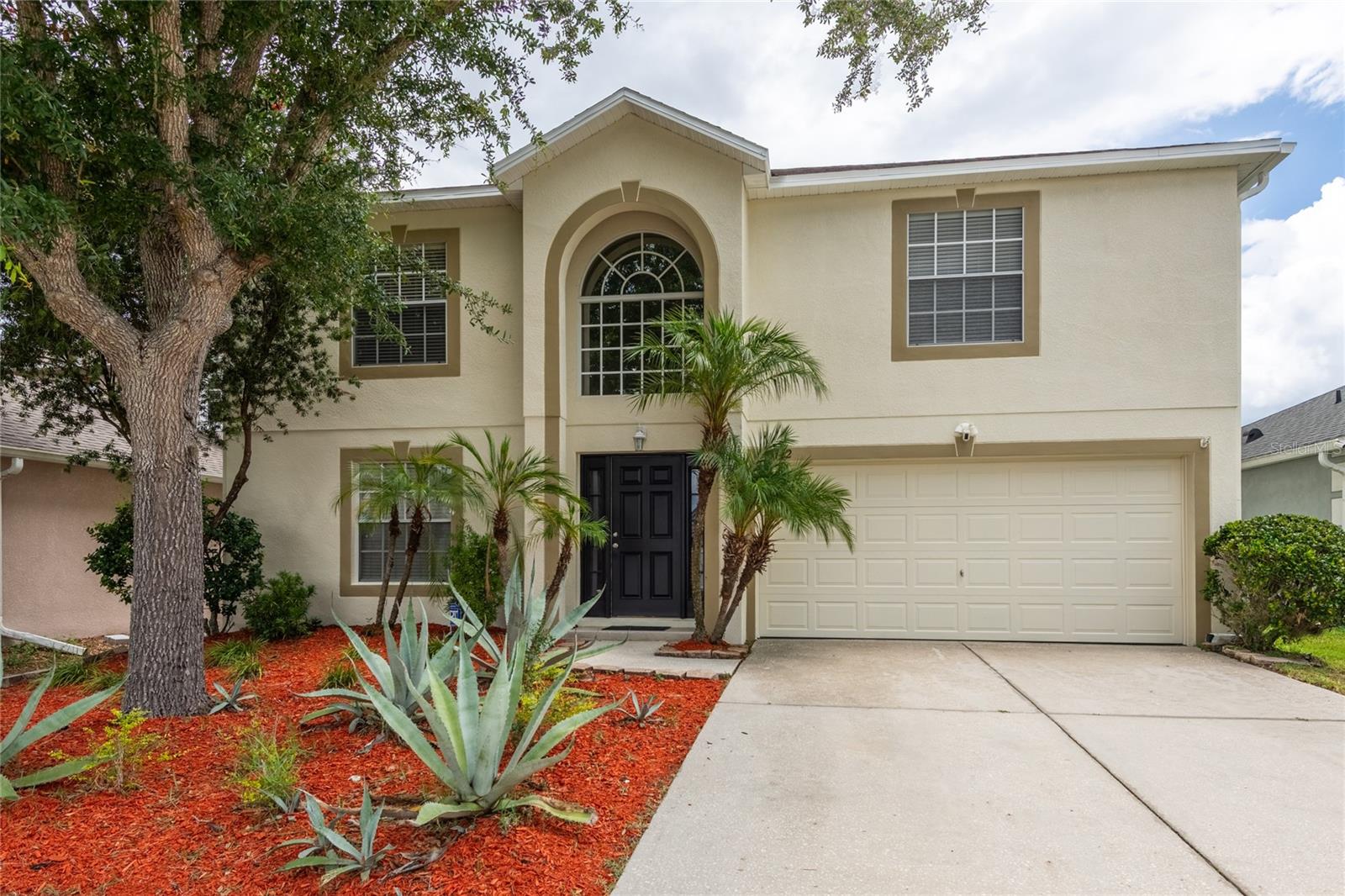 Lovely Conservation Home in the Heart of Land O' Lakes – 4 Bedrooms | 3.5 Bathrooms | 3,000 Sq. Ft.  Welcome to this spacious 3,000-square-foot block home nestled on a peaceful conservation lot in one of Land O' Lakes' most sought-after communities. Located outside of a flood zone and offered at an exceptional price in these top-rated schools!  Step inside to discover luxury vinyl plank flooring throughout the main living areas and bedrooms, complimented by tile in all wet areas. Designed with entertaining in mind, the expansive kitchen and dining area create the ultimate gathering space. The well thought out foot print of the kitchen features two large farmhouse sinks—one positioned in the island and another beneath a large picture window overlooking the private backyard. A huge walk-in pantry provides abundant storage for every culinary need.  The spacious family room is the heart of the home, highlighted by a striking brick electric fireplace that creates a warm and inviting atmosphere for family and guests alike.  Upstairs, retreat to the enormous primary suite featuring three closets, including two walk-in closets, offering exceptional storage and organization. A versatile loft provides endless possibilities for a home office, media room, playroom, or fitness space. The second bedroom enjoys the convenience of two closets and an ensuite bathroom, while two additional, generously sized bedrooms share a full bath.  Additional considerations include:  New roof (only 1 year old), HVAC system less than 3 years old, Gutters and irrigation system, Block construction and Conservation views with no rear neighbors!
Perfectly situated in the booming Land O' Lakes area, you'll enjoy easy access to Tampa International Airport, premier shopping, dining, entertainment, and major commuter routes.  Schedule your private showing today and experience Florida living at its finest!