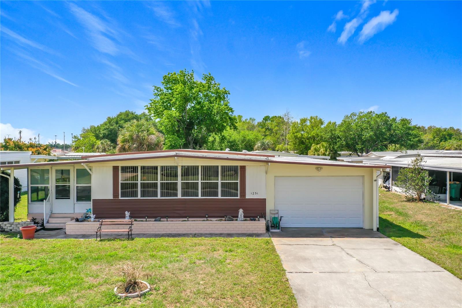 This is the Lake Frances Estates home you have been searching for. YOU OWN THE LAND in this golf cart friendly community. This house checks all of the boxes. It is one of the very few in this community with a garage. Huge Primary bedroom with 3 closets and en-suite bathroom was built with your comfort in mind. The other generously sized bedroom is perfect for friends and family. The massive living room is open and big enough for all of your favorite furnishings. It has a metal roof for long lasting protection. It is light, bright, clean and easy to maintain and most importantly ready to move in as soon as you close. It comes partially furnished. Enjoy an afternoon of fishing or fun nights playing bingo. Enjoy the luxury of having both indoor and outdoor heated pools to choose from. Shuffleboards and pool tables are all included in this community. Card games and movie nights at the clubhouse. This community has too many events and perks to list them all. Wooten Park, Mt Dora and Eustis are all just minutes away. All three have Street Fairs and live music. Orlando and Sanford airports and Disney are all about 30 miles away. Both coasts are only about 90 minutes away. Don't let this gem pass you by. The Buyer and/or Buyer's Agent shall be obligated to diligently investigate, verify, and confirm all pertinent aspects of the subject property. Please note that while all information provided is deemed to be reliable, its accuracy and completeness are not warranted or guaranteed.