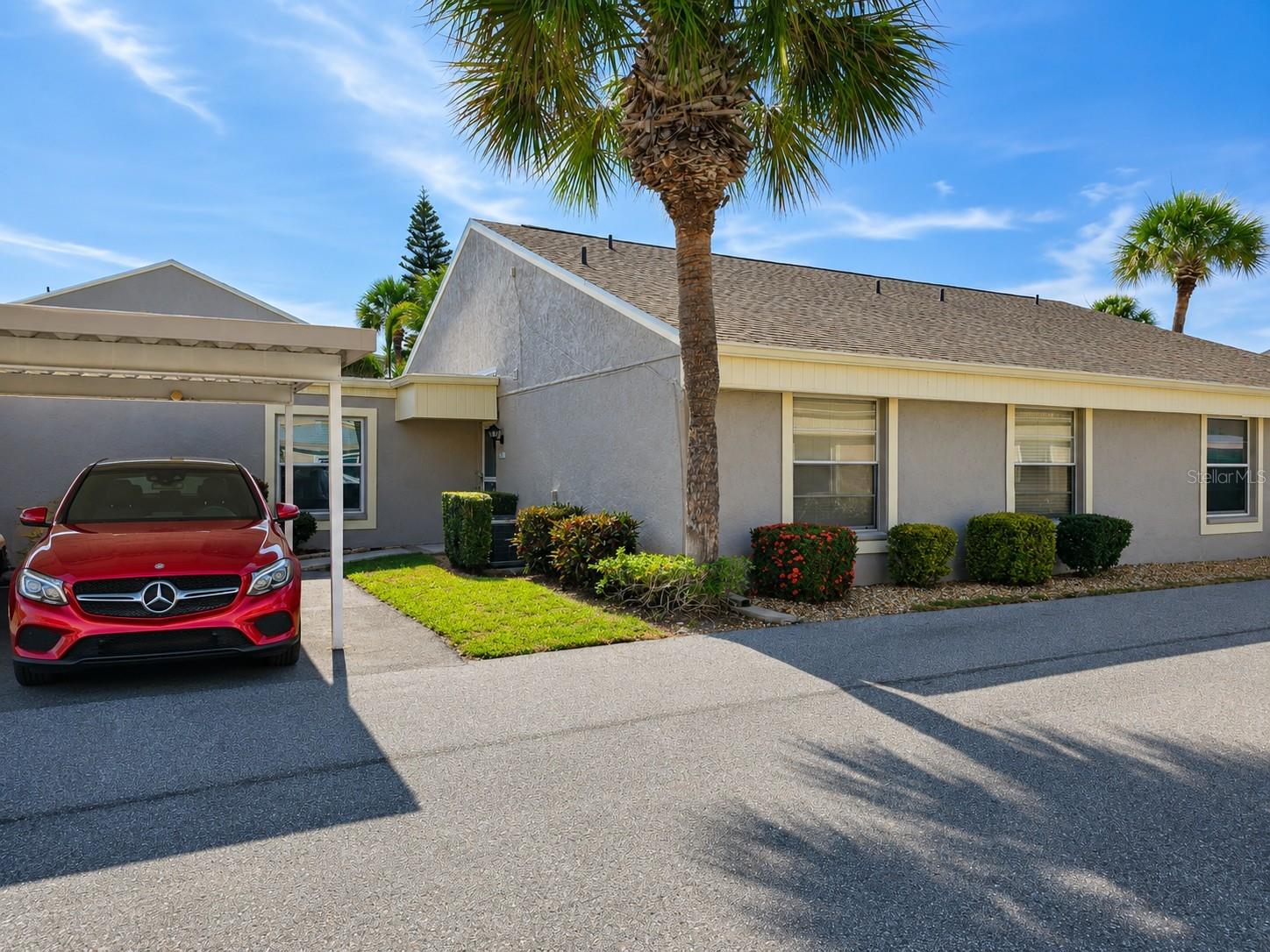 Imagine finding the perfect place to call home—just five miles from what many consider one of the most beautiful beaches in the world! This turnkey furnished, move-in-ready condominium allows you to start living your Florida dream immediately—just bring your clothes and toiletries.

Endless sunsets await as you enjoy your morning coffee on the spacious lanai overlooking the pool and unwind in the afternoon with your favorite beverage while basking in the sunshine and Gulf breezes. This tastefully decorated two-bedroom, two-bath residence features a charming coastal design and a highly sought-after single-story floor plan with no neighbors above.

Additional features include an inside laundry area, a covered carport conveniently located just outside your front door, and a spacious enclosed lanai with all-season windows that create a versatile flex space while seamlessly blending indoor and outdoor living. The entire home has beautiful luxury vinyl plank flooring and tile on the porch. The lanai has a spacious outdoor closet. The bathrooms have update vanities, The building's roof is brand new.

The monthly condominium fee provides exceptional value and includes water, sewer, trash service, cable television, pest control, exterior maintenance, escrow reserves, access to two community pools, and a clubhouse.

Ideally located just off Manatee Avenue, this community offers convenient access to shopping, restaurants, grocery stores, and public transportation. Nearby, you'll find GT Bray Park's 140 acres of recreational amenities, including a state-of-the-art fitness center and 20 covered outdoor pickleball courts. For nature enthusiasts, Robinson Preserve is just minutes away, offering kayaking, scenic hiking and biking trails, and abundant wildlife viewing opportunities. Lots of opportunity for Golf and tennis nearby.

With no age restrictions and small pets welcome, this property is the perfect year-round residence, seasonal retreat, or vacation home. Come experience the Florida lifestyle you've always dreamed of!